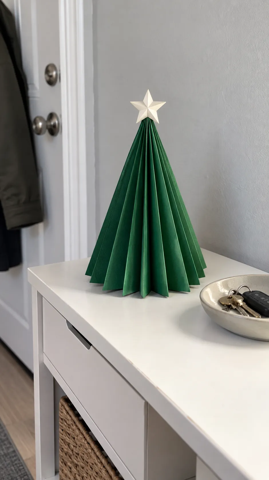 Stand a folded paper tree on a console as a compact Christmas display in an apartment