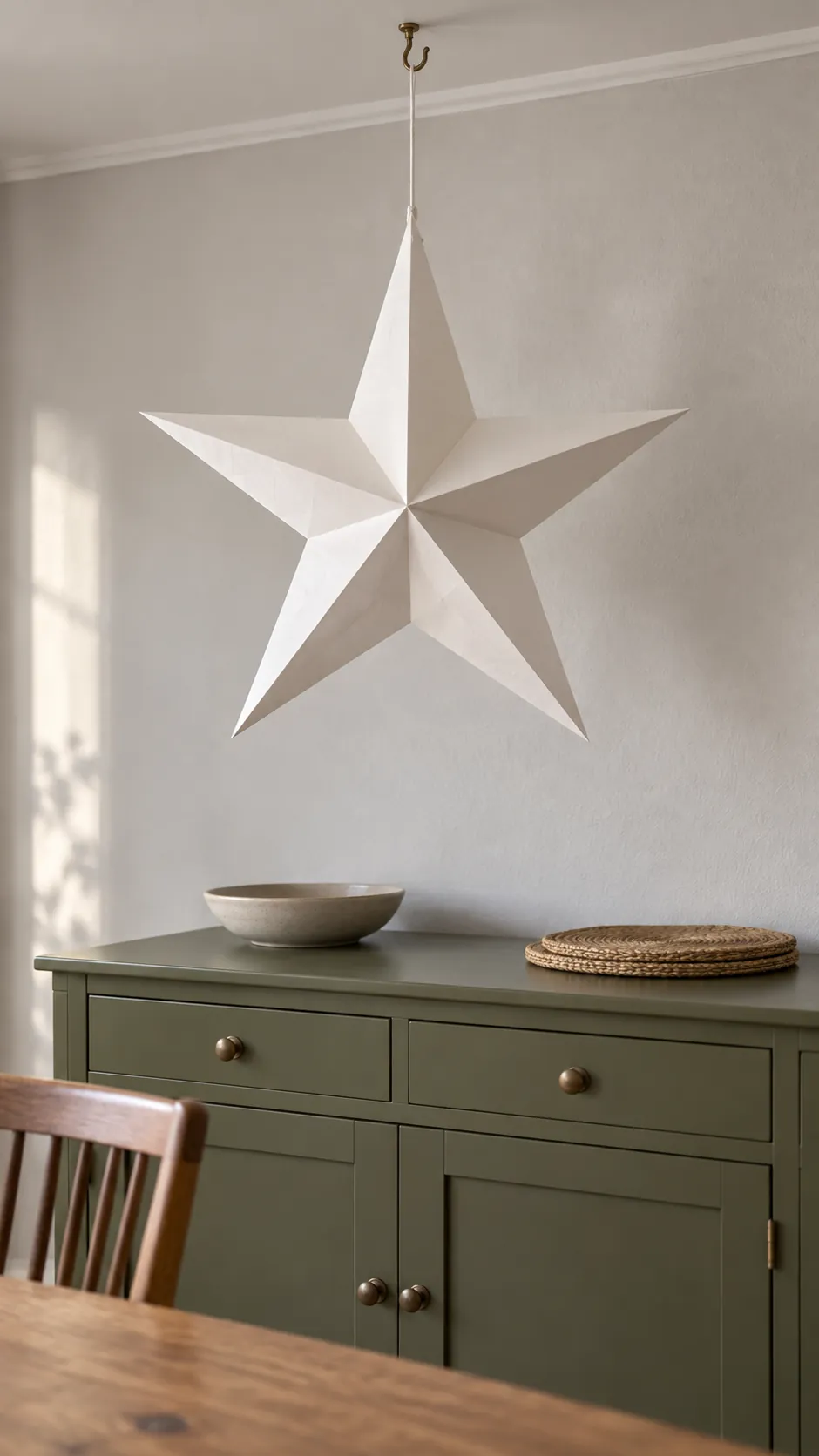 Suspend one paper star over a useful surface as a compact Christmas display in an apartment