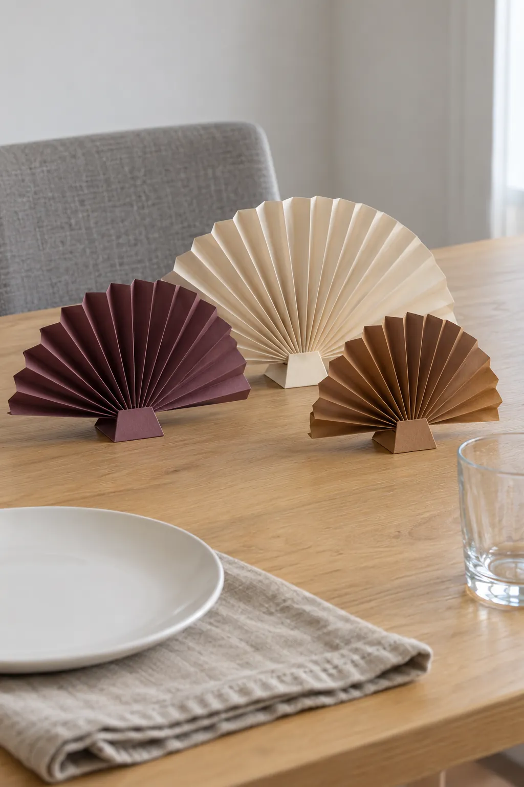 Low accordion paper fans as a Thanksgiving centerpiece without candles