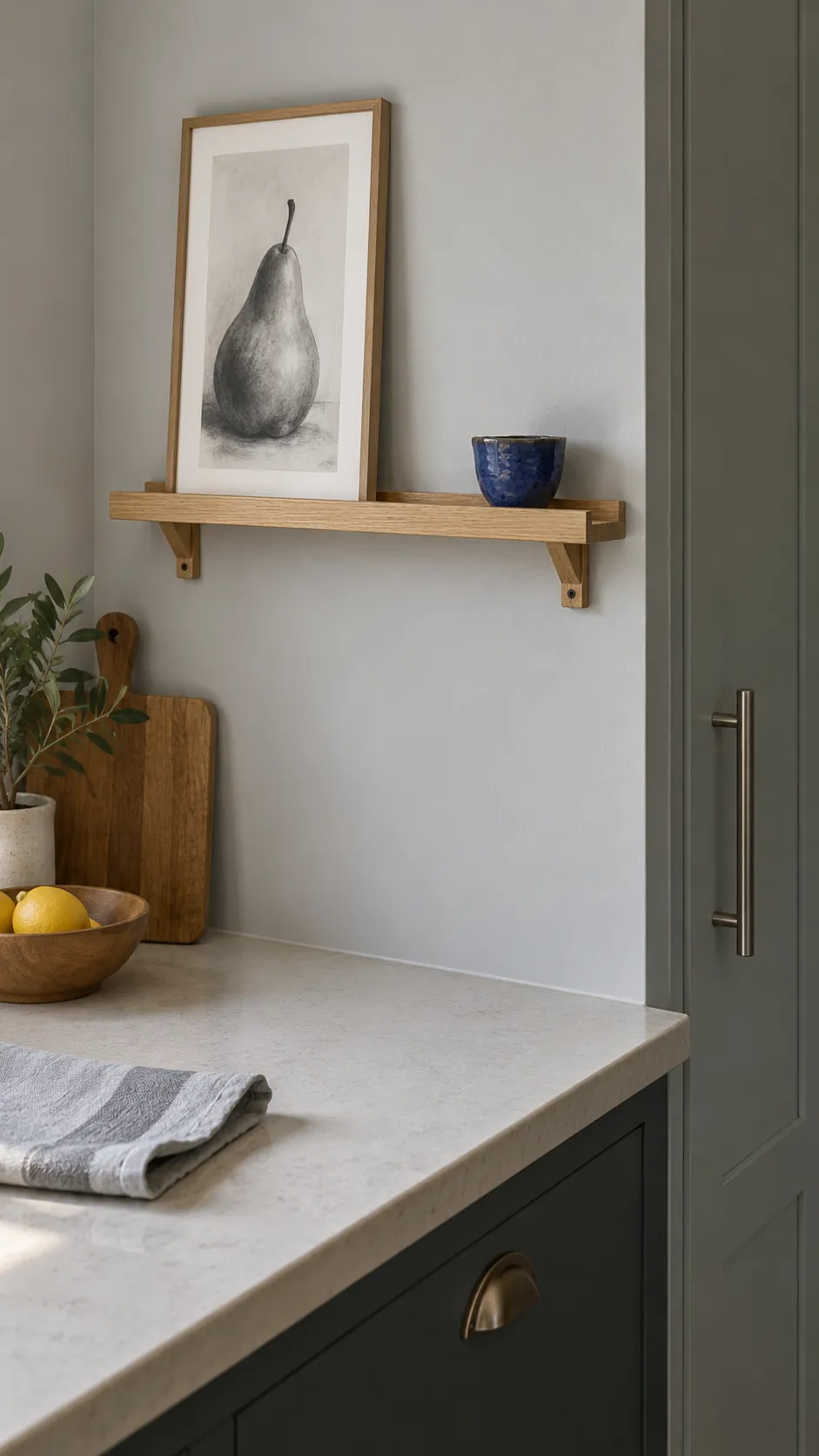 A slim picture ledge in a practical kitchen