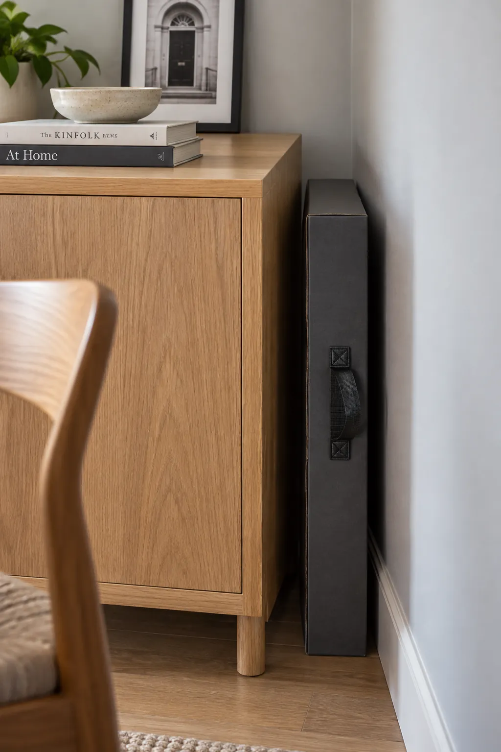 Slim tree package behind an apartment cabinet