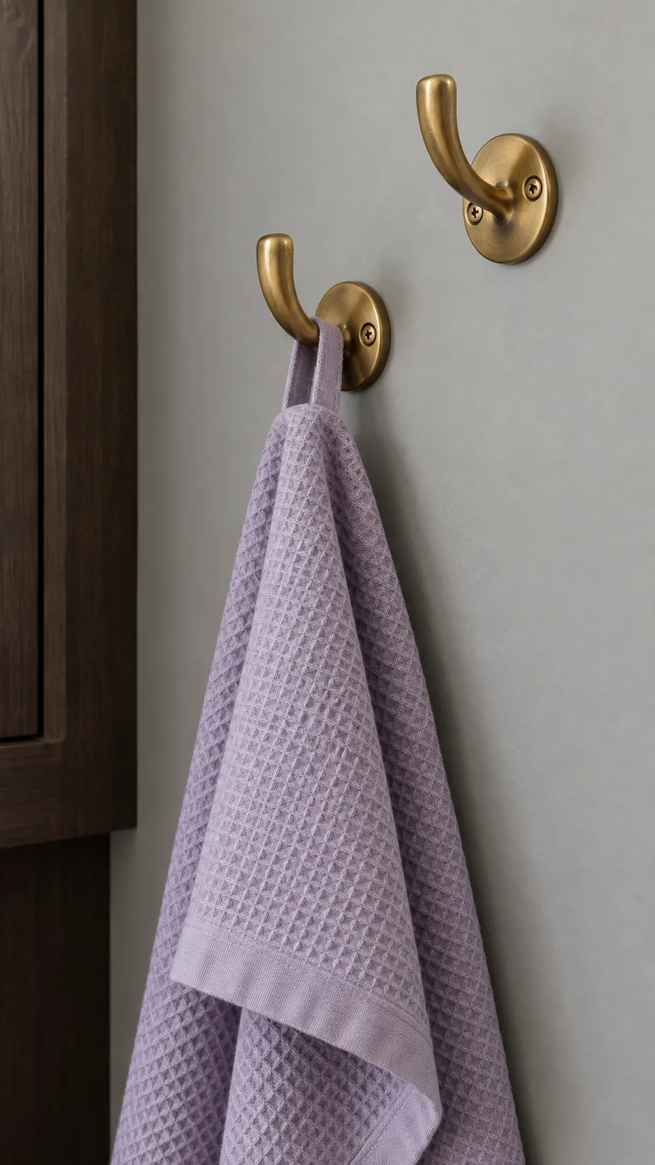 A pair of sculptural hooks in a practical kitchen
