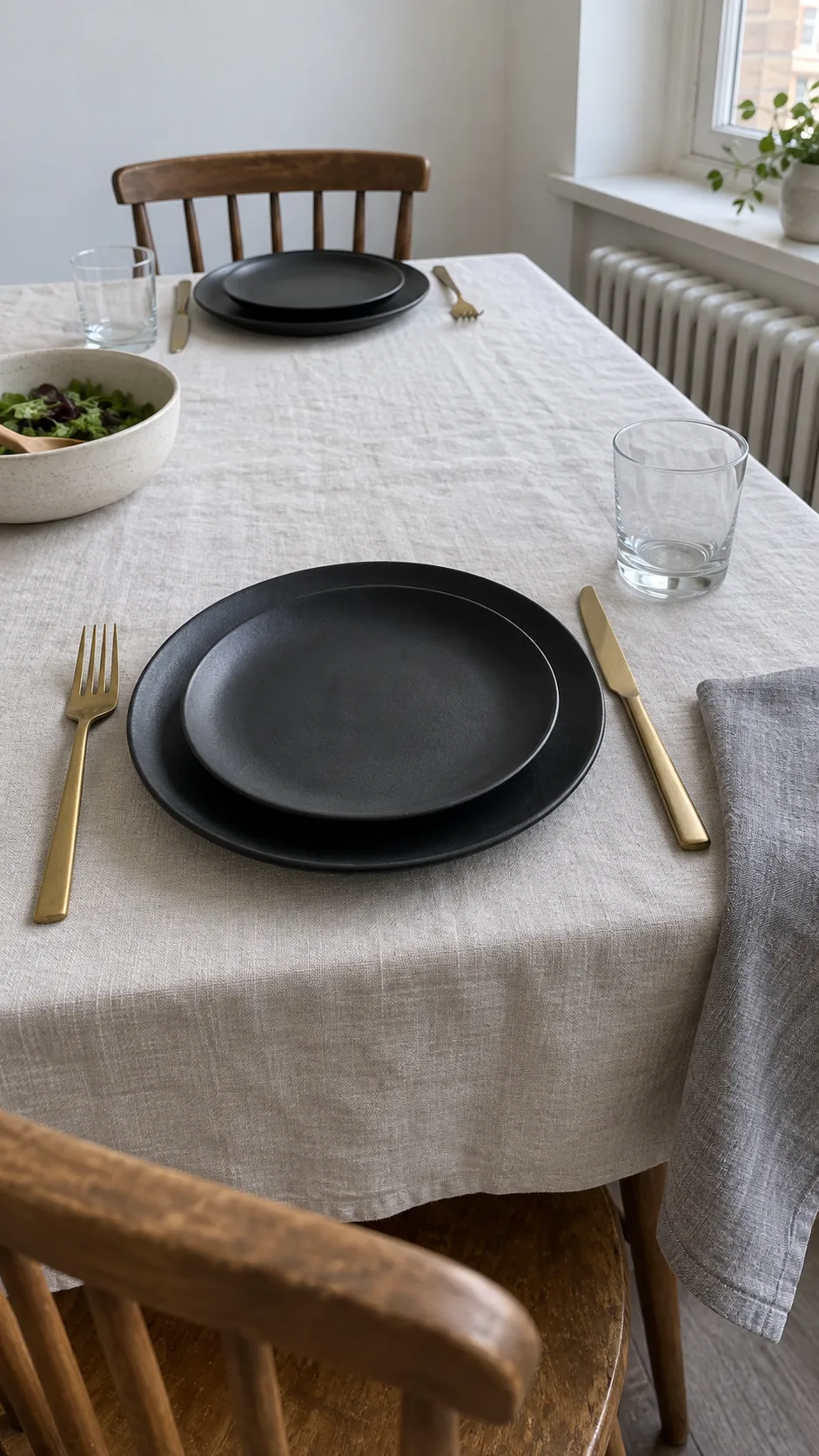 Black Plates against Pale Linen for a moody Thanksgiving tablescape