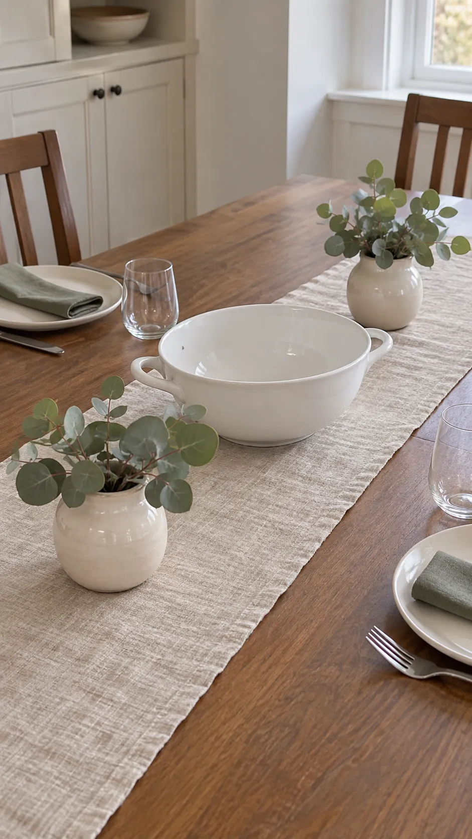 A Linen Runner with Contained Eucalyptus in a vintage Thanksgiving setting