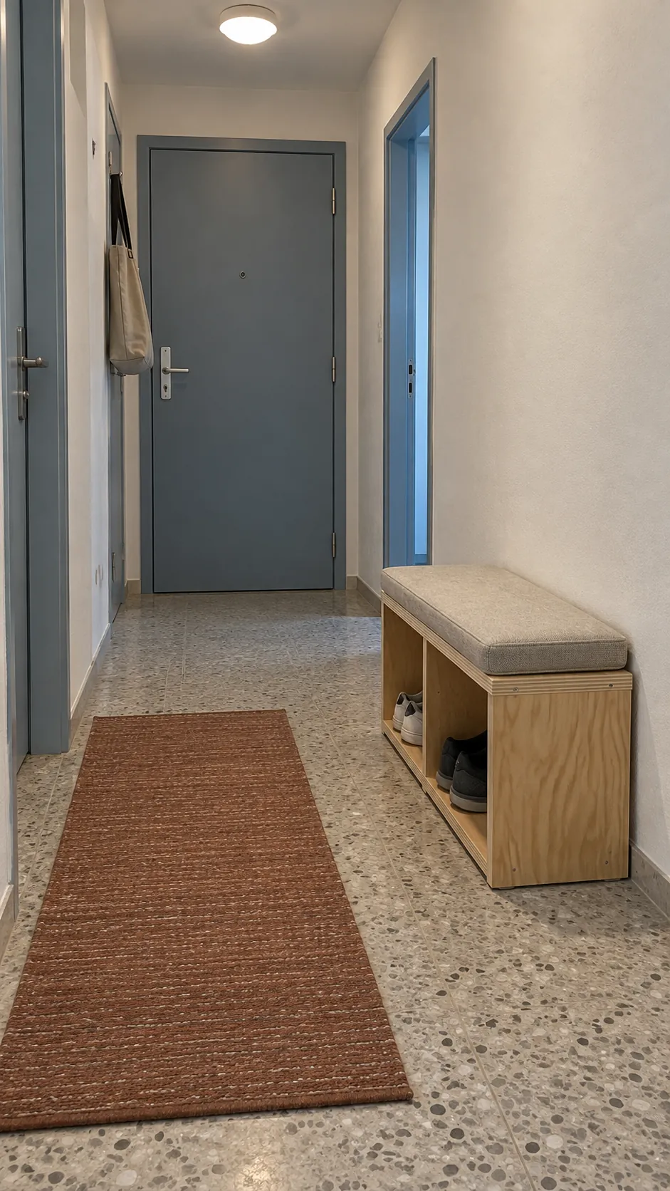 Completed shoe bench with two open compartments in a clear hallway