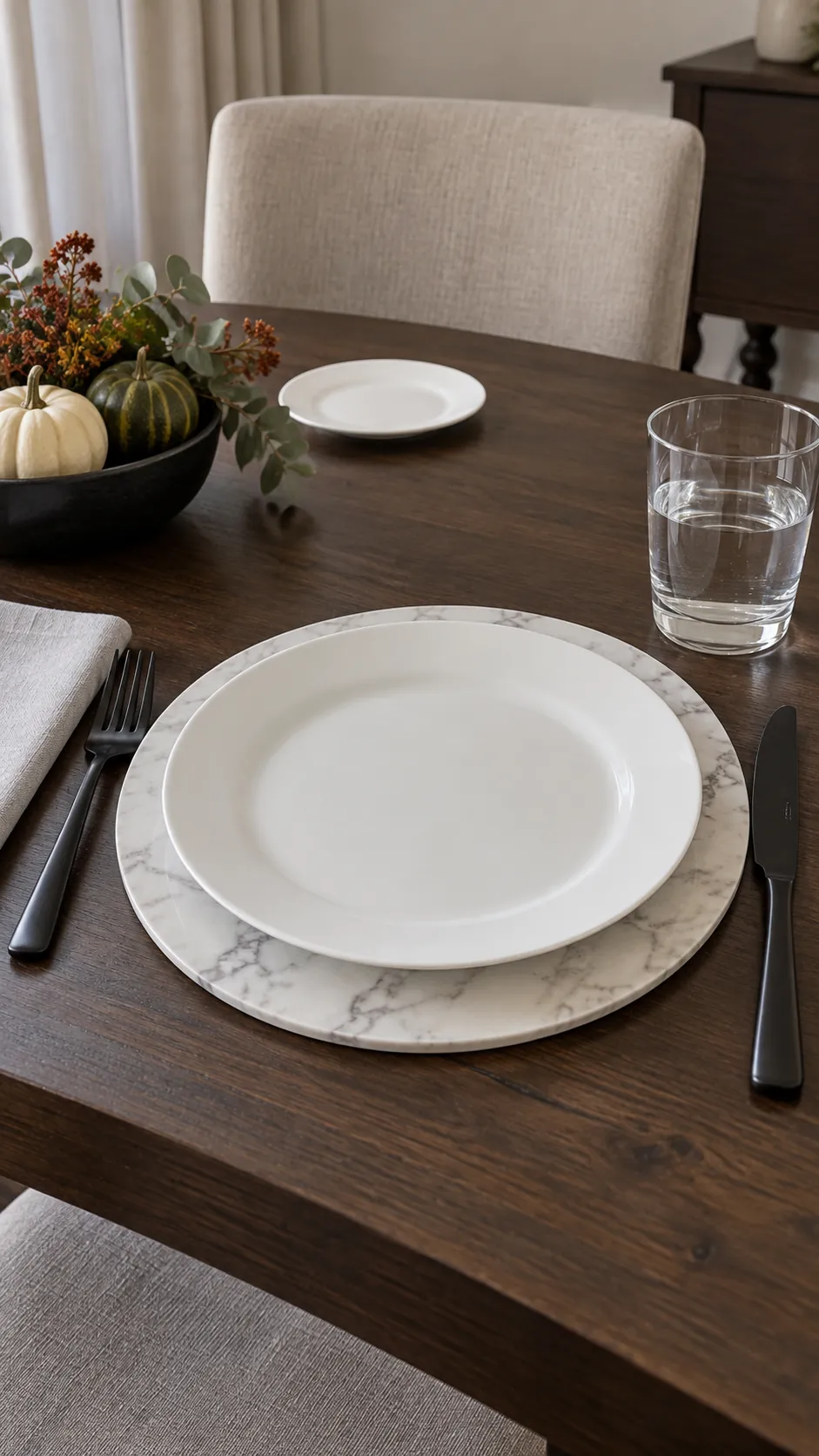 Marble Look Chargers with Black Flatware for a black and white Thanksgiving table