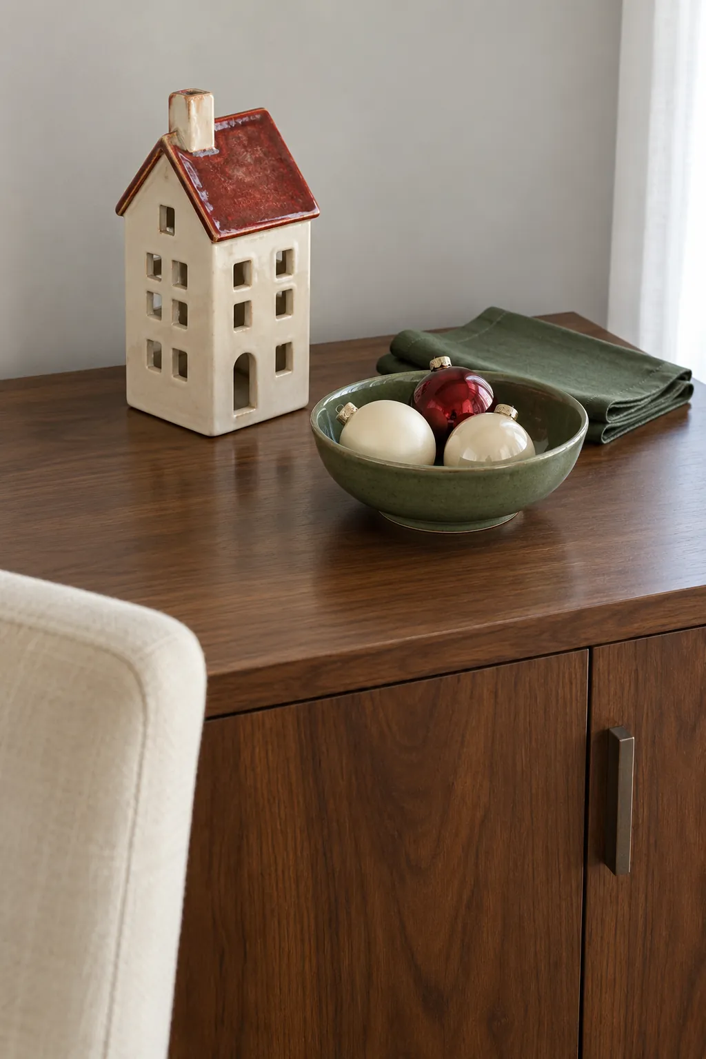 Cream red and green decorations grouped into a Christmas color palette