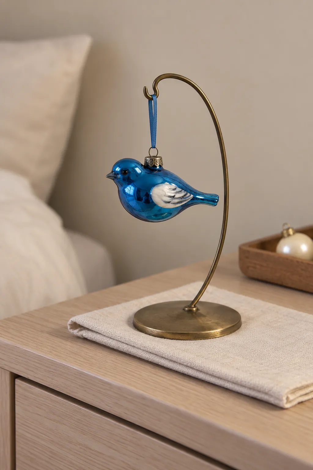 A bright vintage ornament displayed separately on a freestanding stand