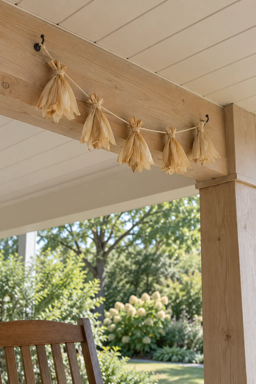 A Short Corn Husk Accent on a Sheltered Beam outdoor Thanksgiving decoration