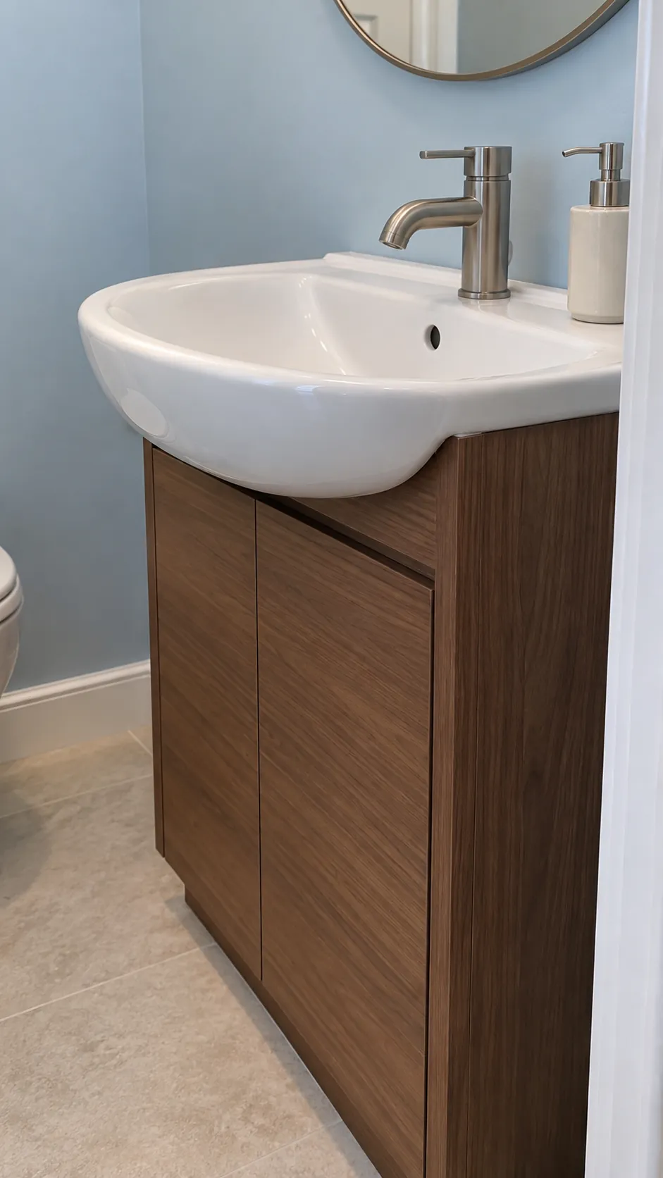 Basin projecting beyond its compact cabinet