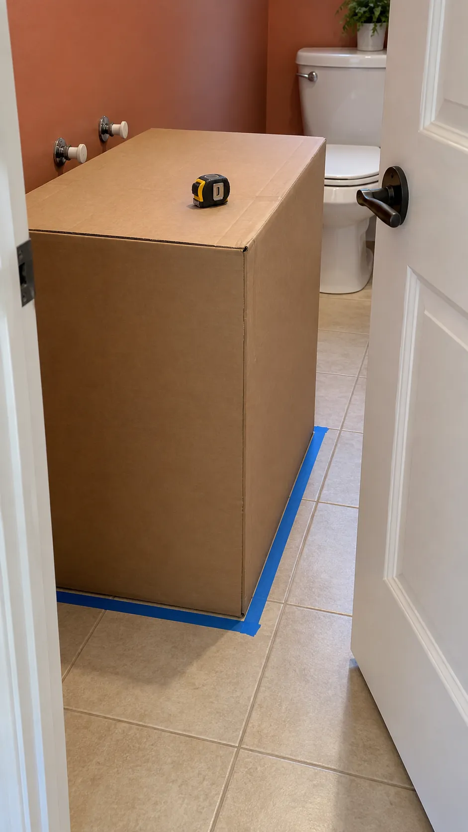 Cardboard footprint checking bathroom door clearance