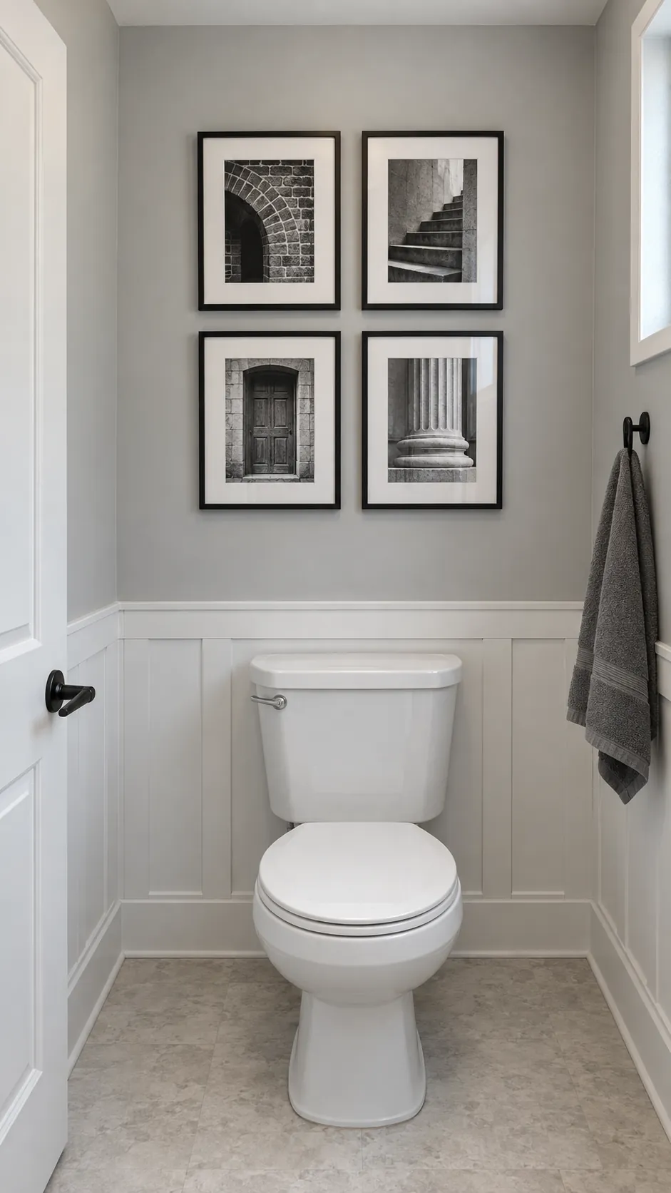 A restrained grid of small architectural photographs above a powder room toilet