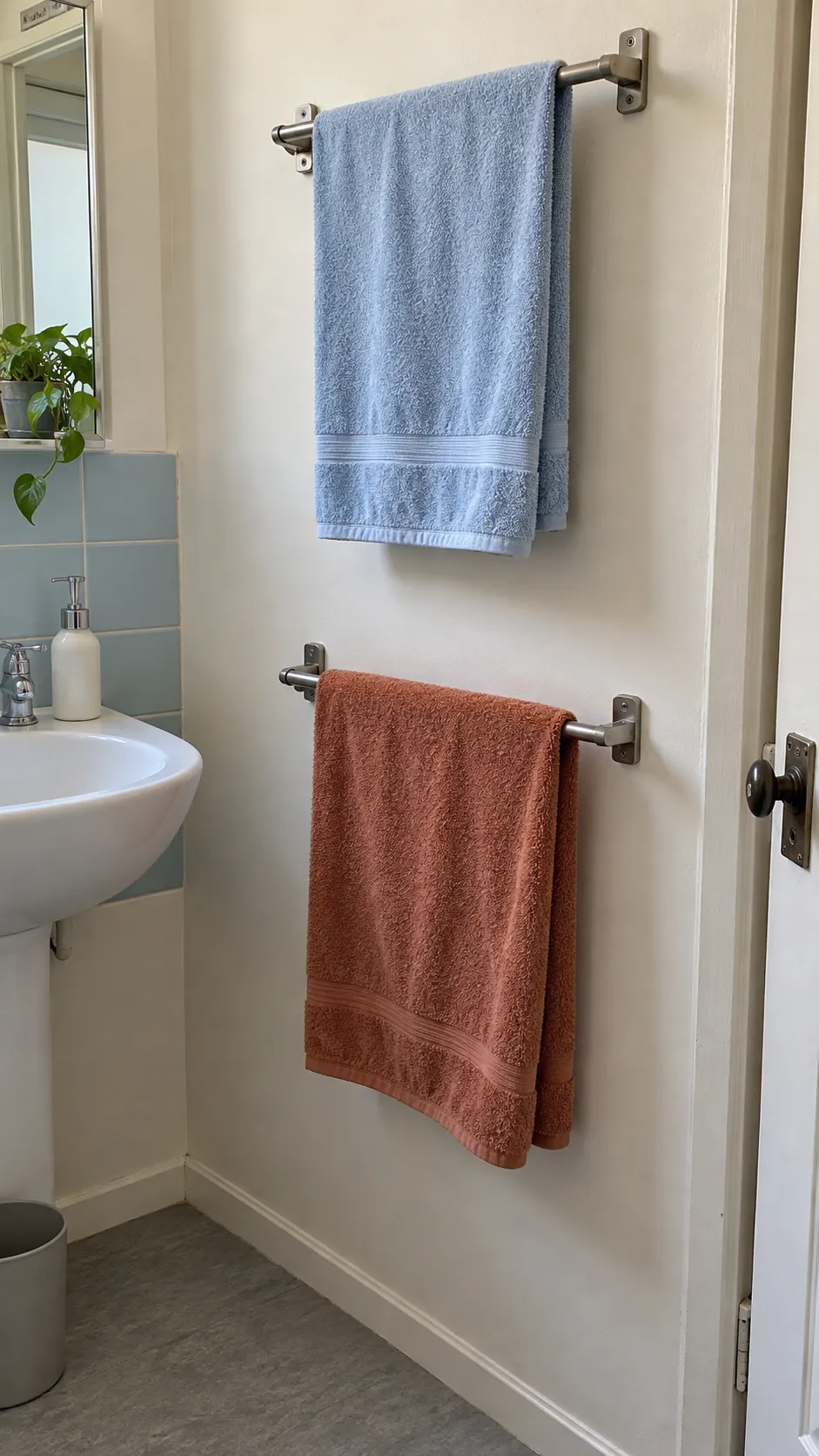 Separate towel drying spaces for two people sharing one sink