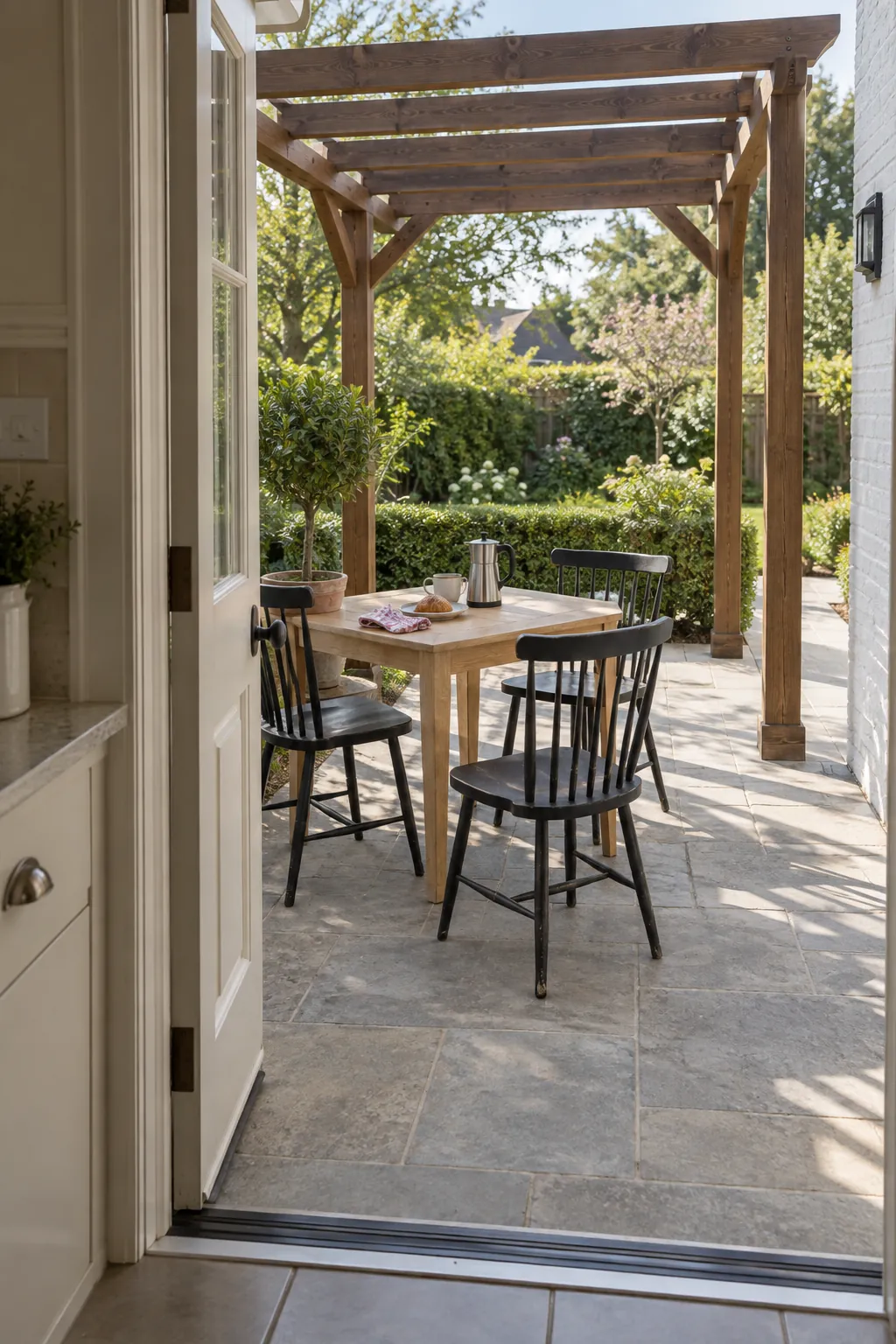A breakfast nook just beyond the kitchen in a small outdoor space