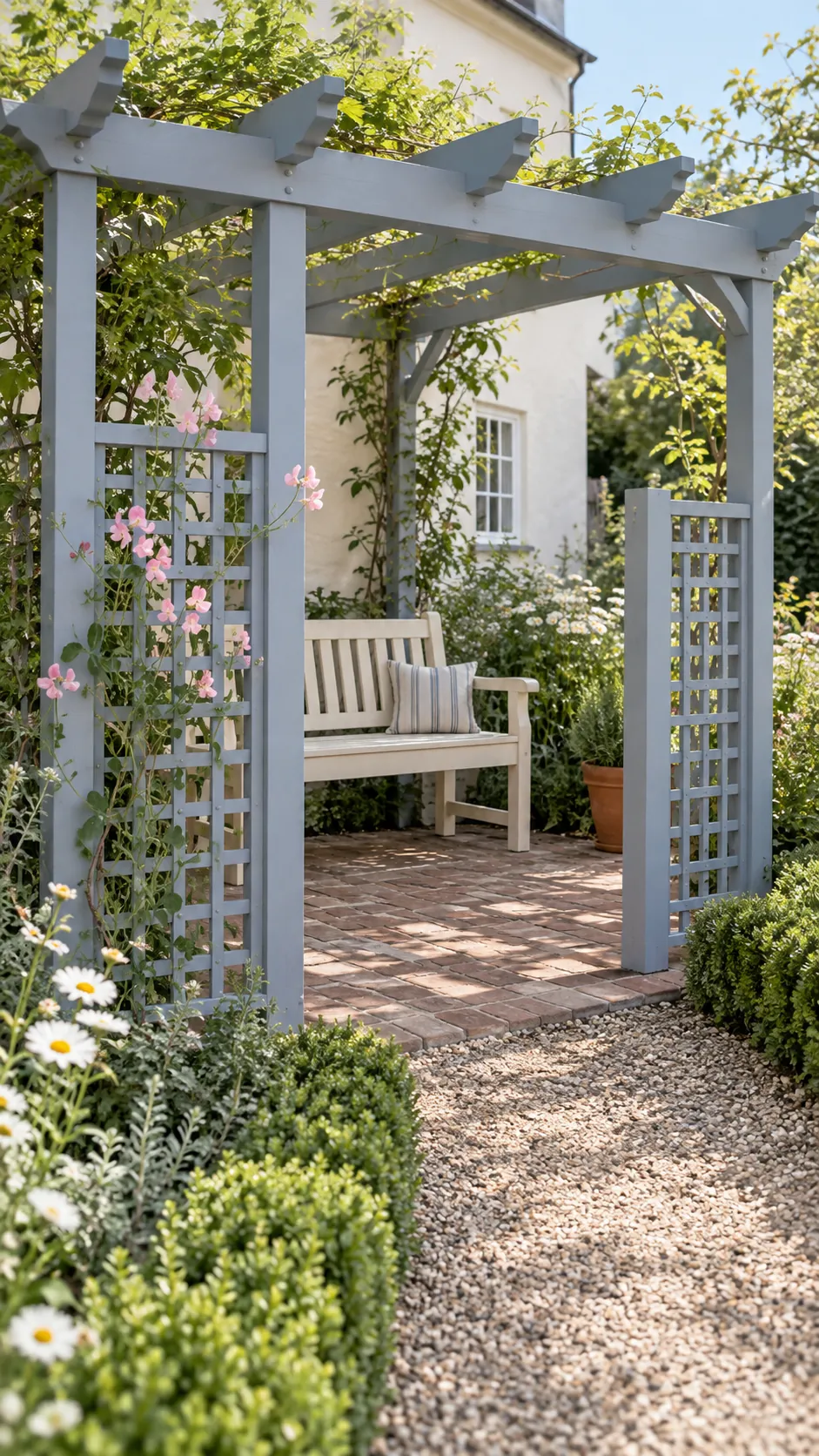 An entrance framed by simple trellis panels in a cottage garden pergola setting