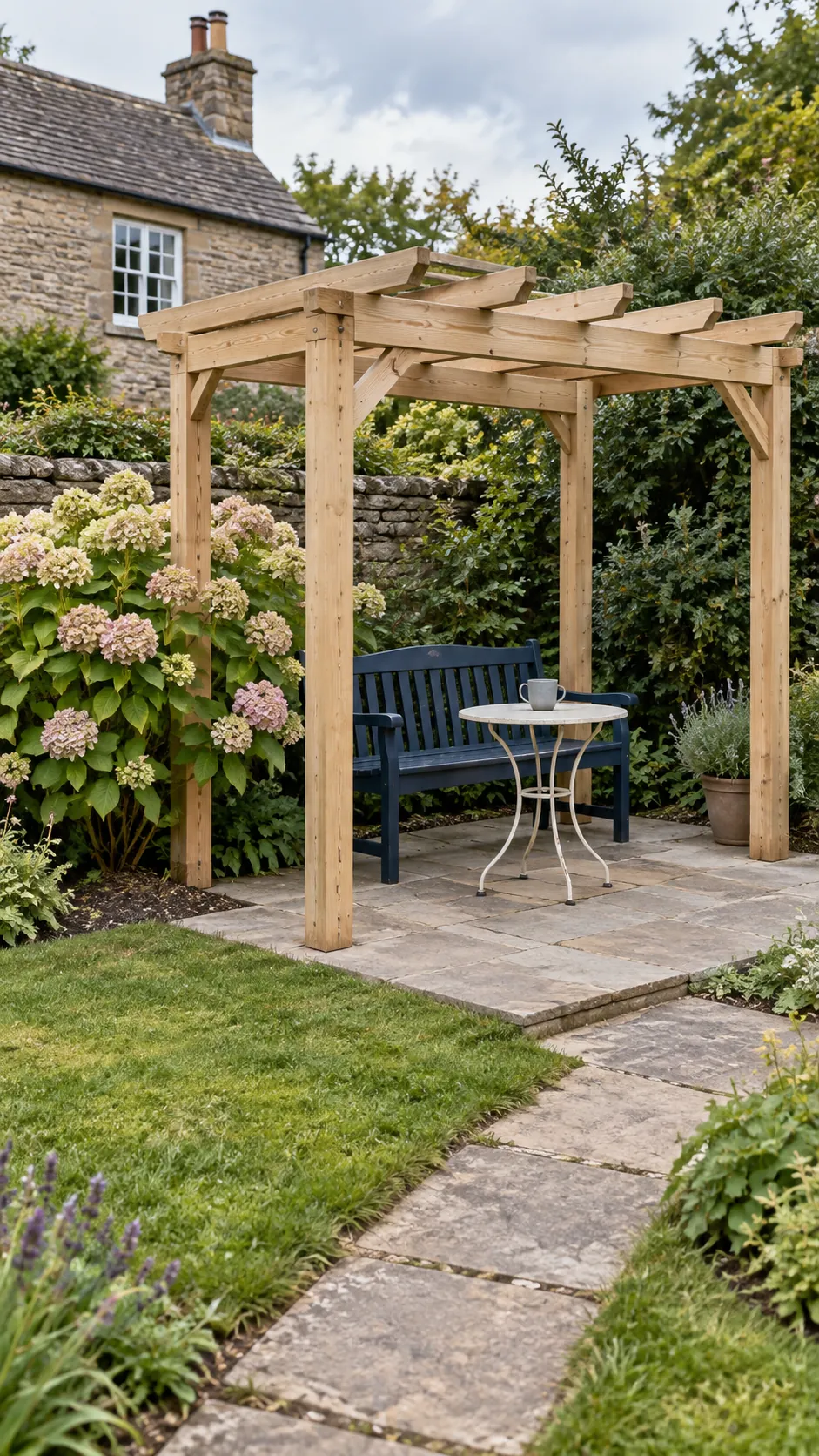 A simple frame beside existing mature planting in a cottage garden pergola setting