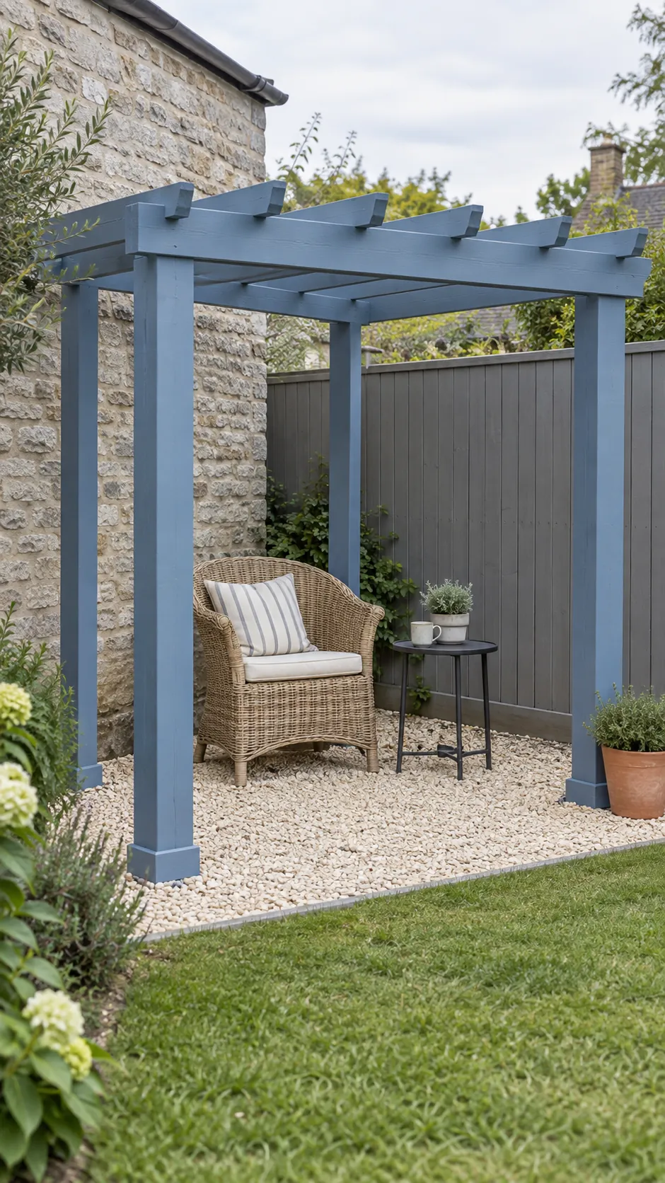A painted frame against a plain boundary in a small corner pergola layout