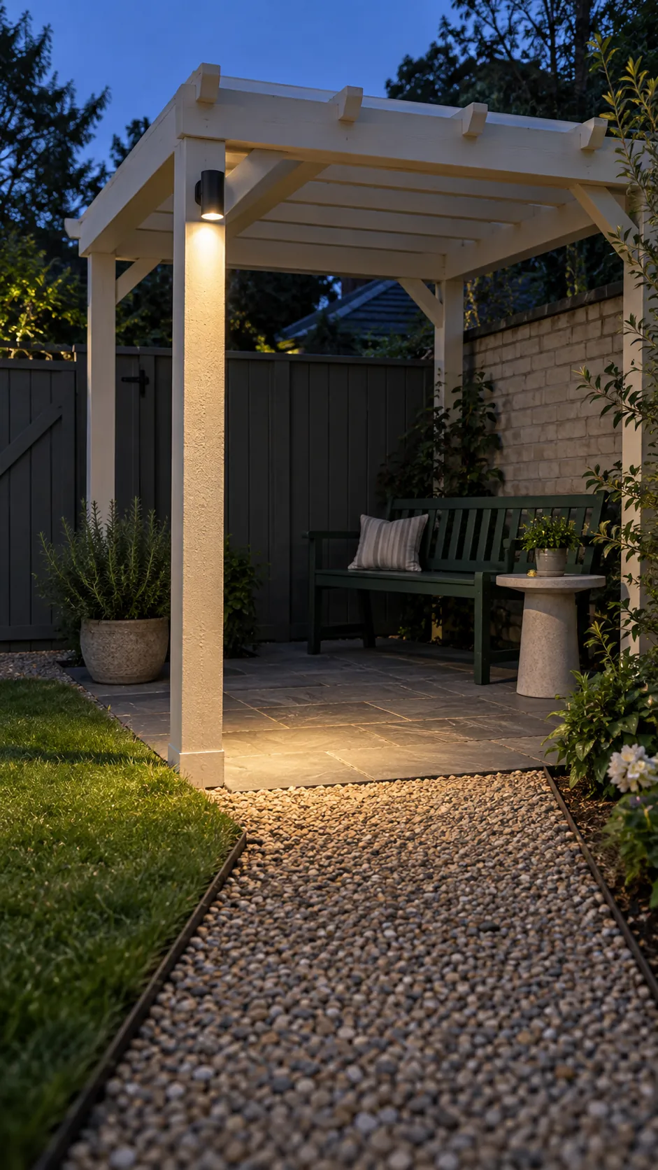 A modest light beside the entrance in a small corner pergola layout