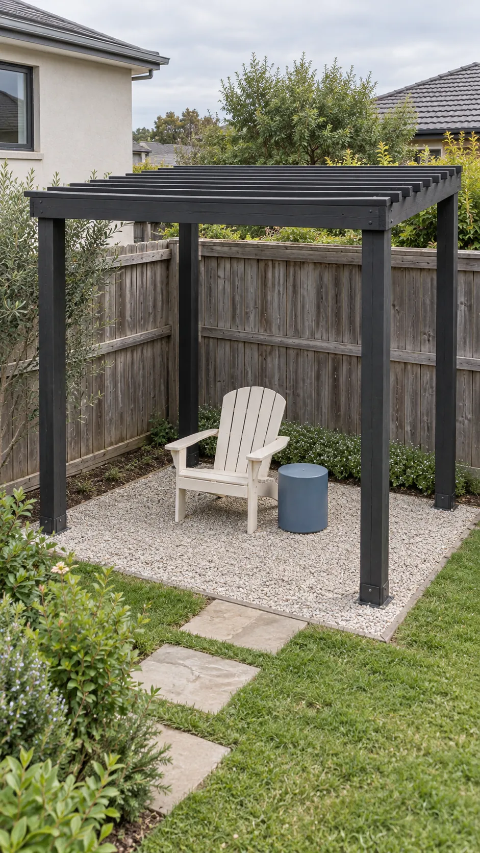 A freestanding frame clear of the fence in a small corner pergola layout