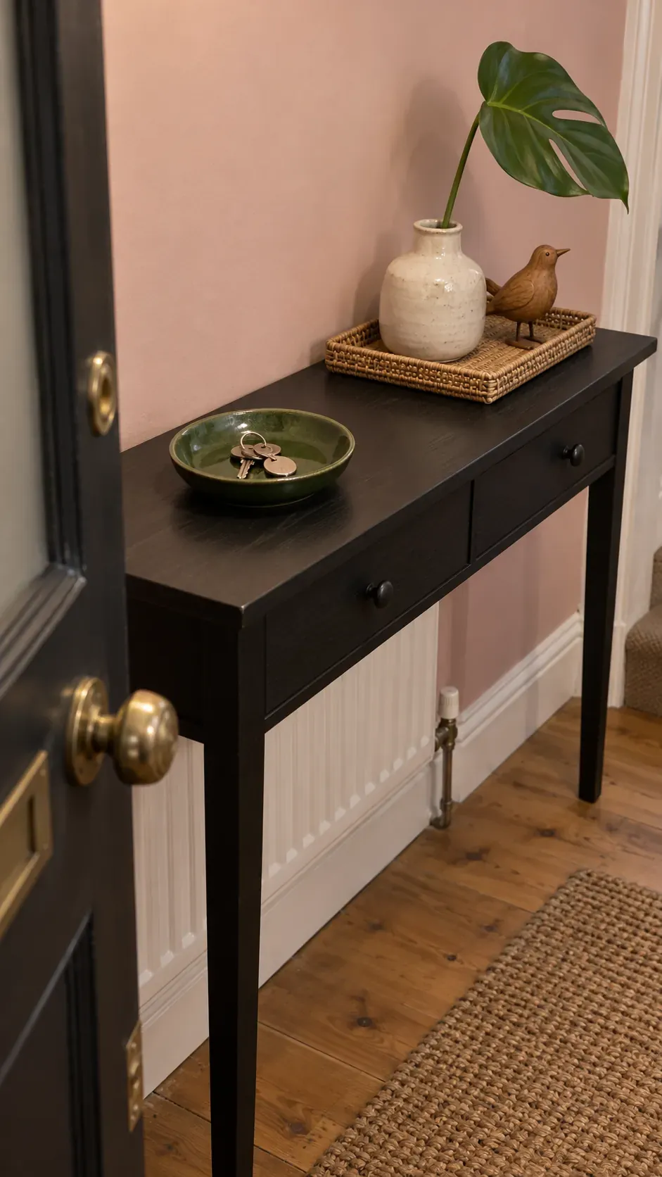 A Small Decorative Group on a Separate Tray on an entryway console with accessible keys