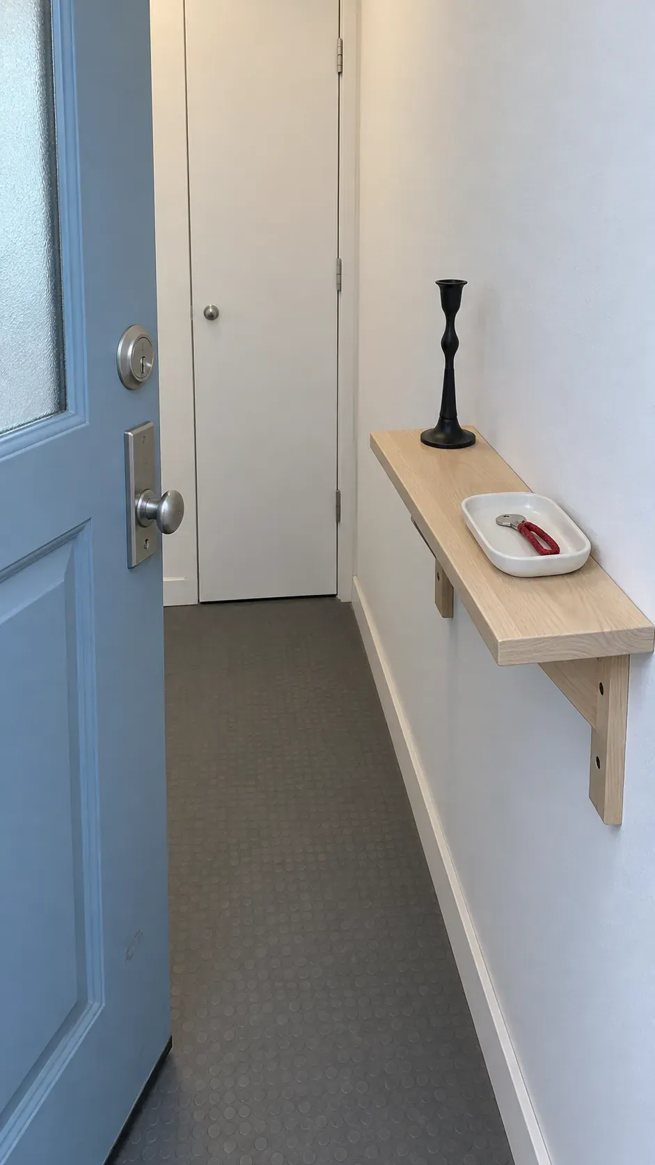 A Narrow Console with Just Two Essentials on an entryway console with accessible keys