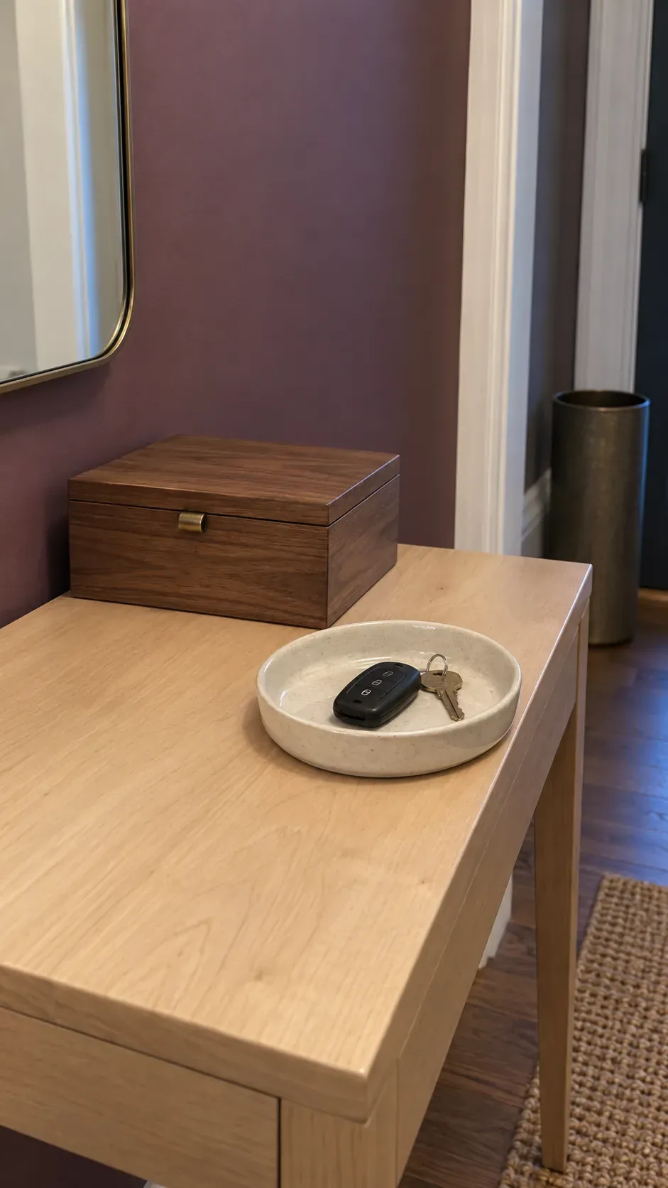 A Lidded Box Behind the Open Tray on an entryway console with accessible keys