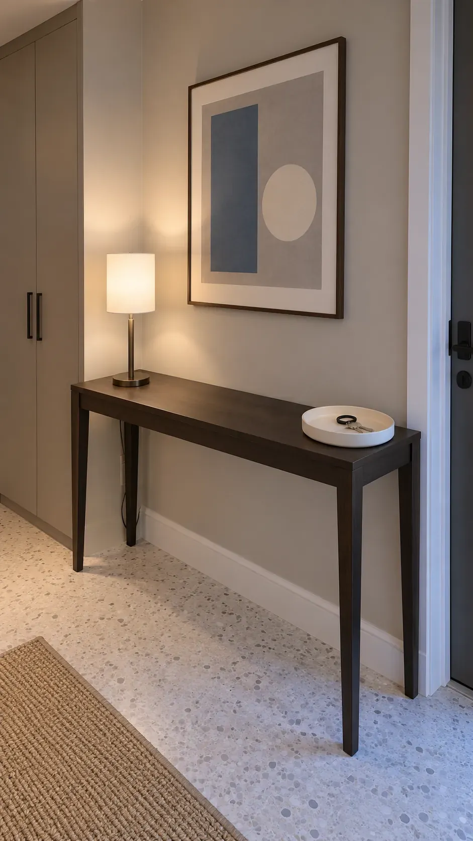 An Open Center with Decoration at the Edges on an entryway console with accessible keys