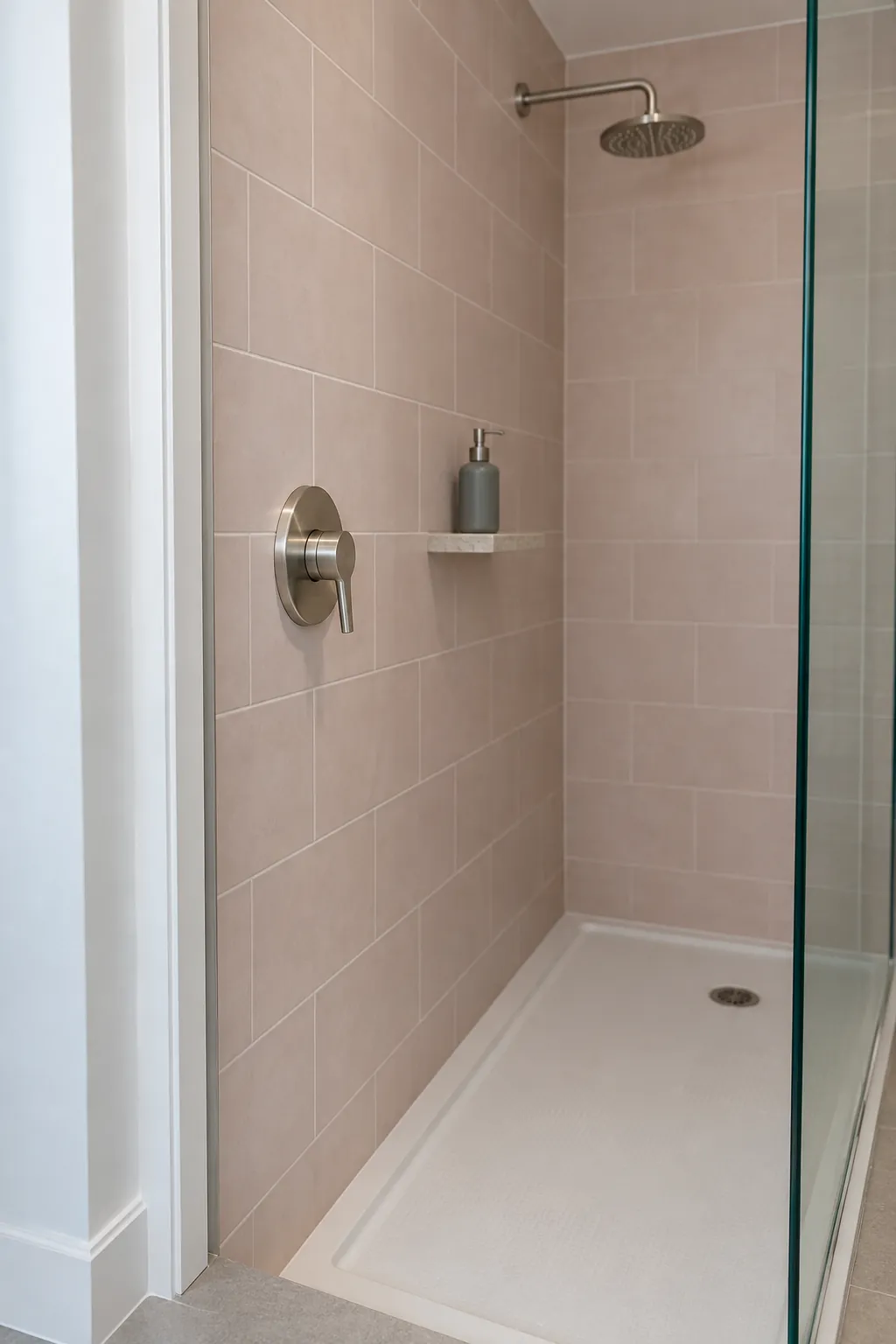 Shower controls near the entry of a small tiled enclosure