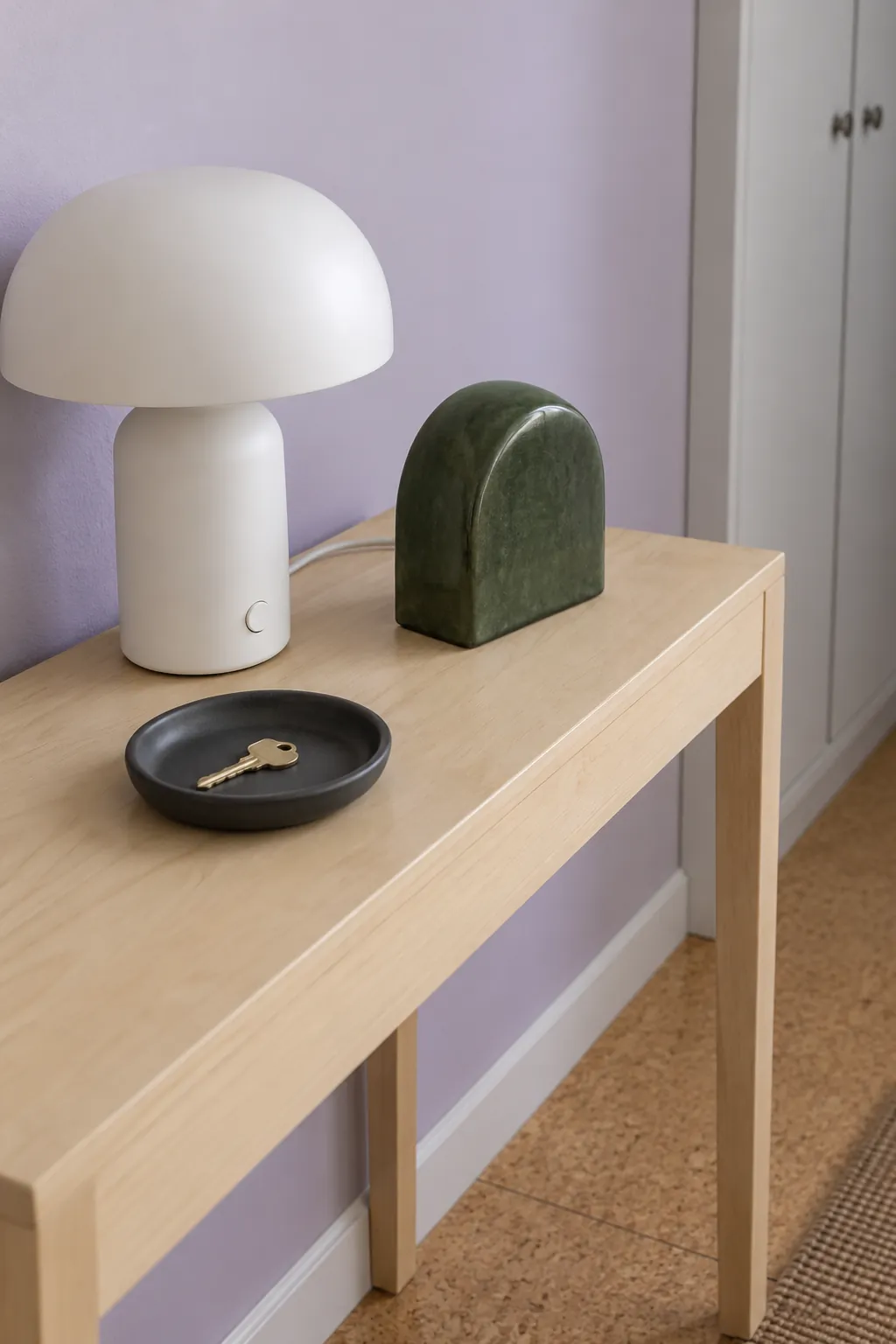 Put a Solid Sculptural Object Across the Sightline in an entryway lamp and console arrangement