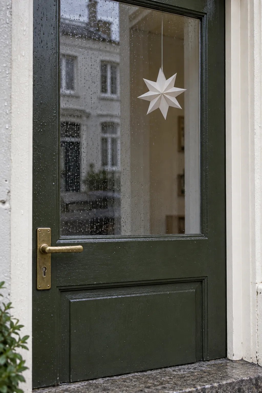 A festive view from inside the glass for a rain exposed Christmas entrance