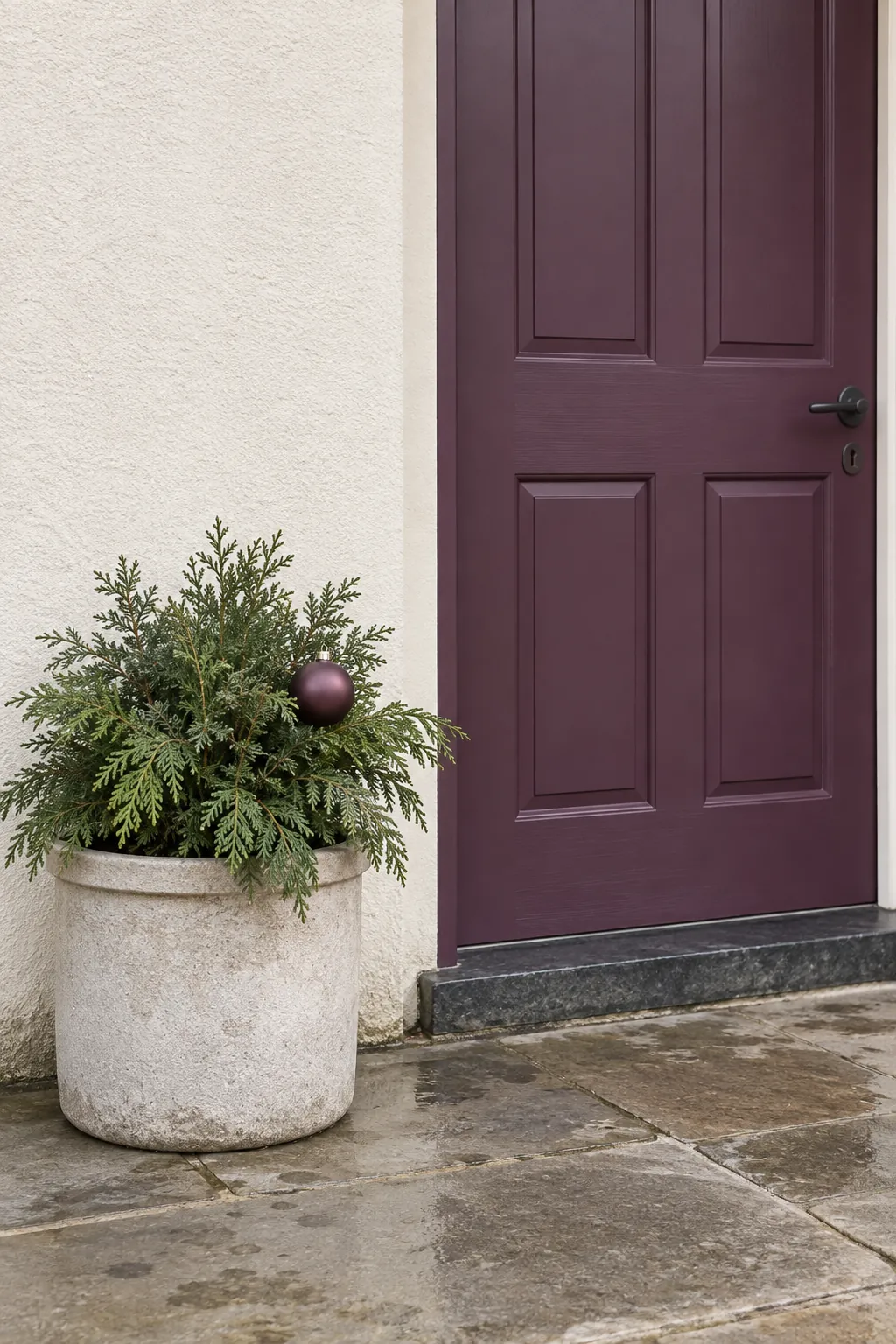 A door color carried into one small accent for a rain exposed Christmas entrance