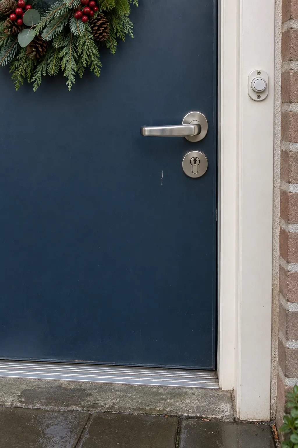 A simple arrangement that leaves the handle obvious for a rain exposed Christmas entrance