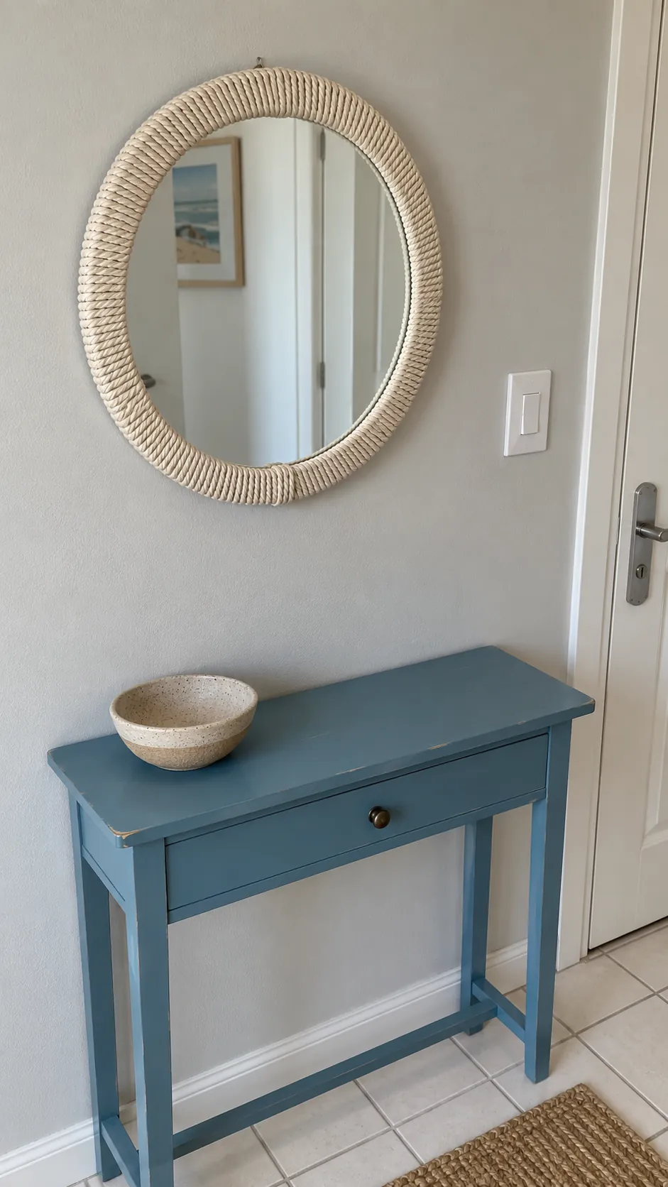 Wrap a small owned frame with cord on an existing entryway mirror