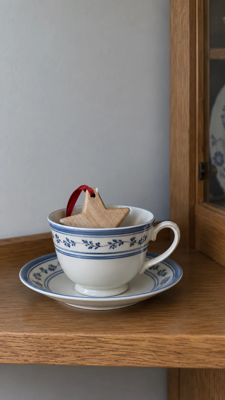 Show a seasonal ornament in the cup with inherited teacups