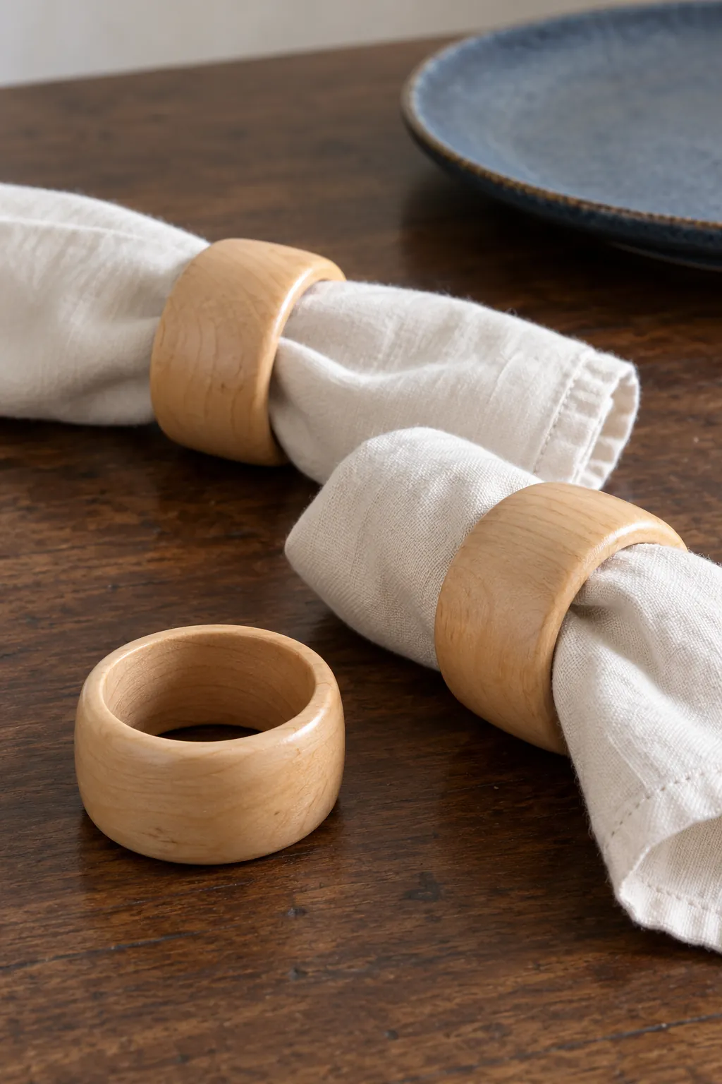 Plain wooden napkin rings in a natural Christmas home