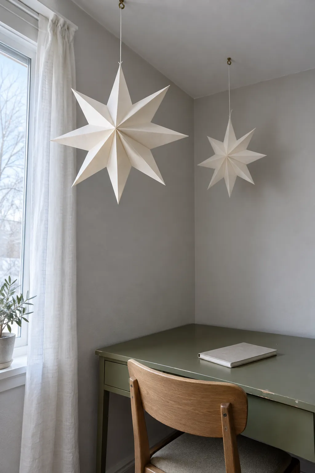 Folded paper stars in a quiet corner in a natural Christmas home