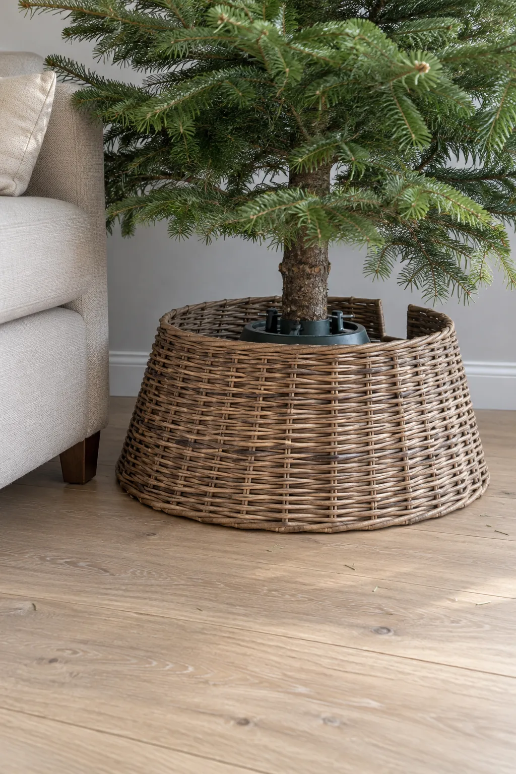 A woven cover around the tree stand in a natural Christmas home