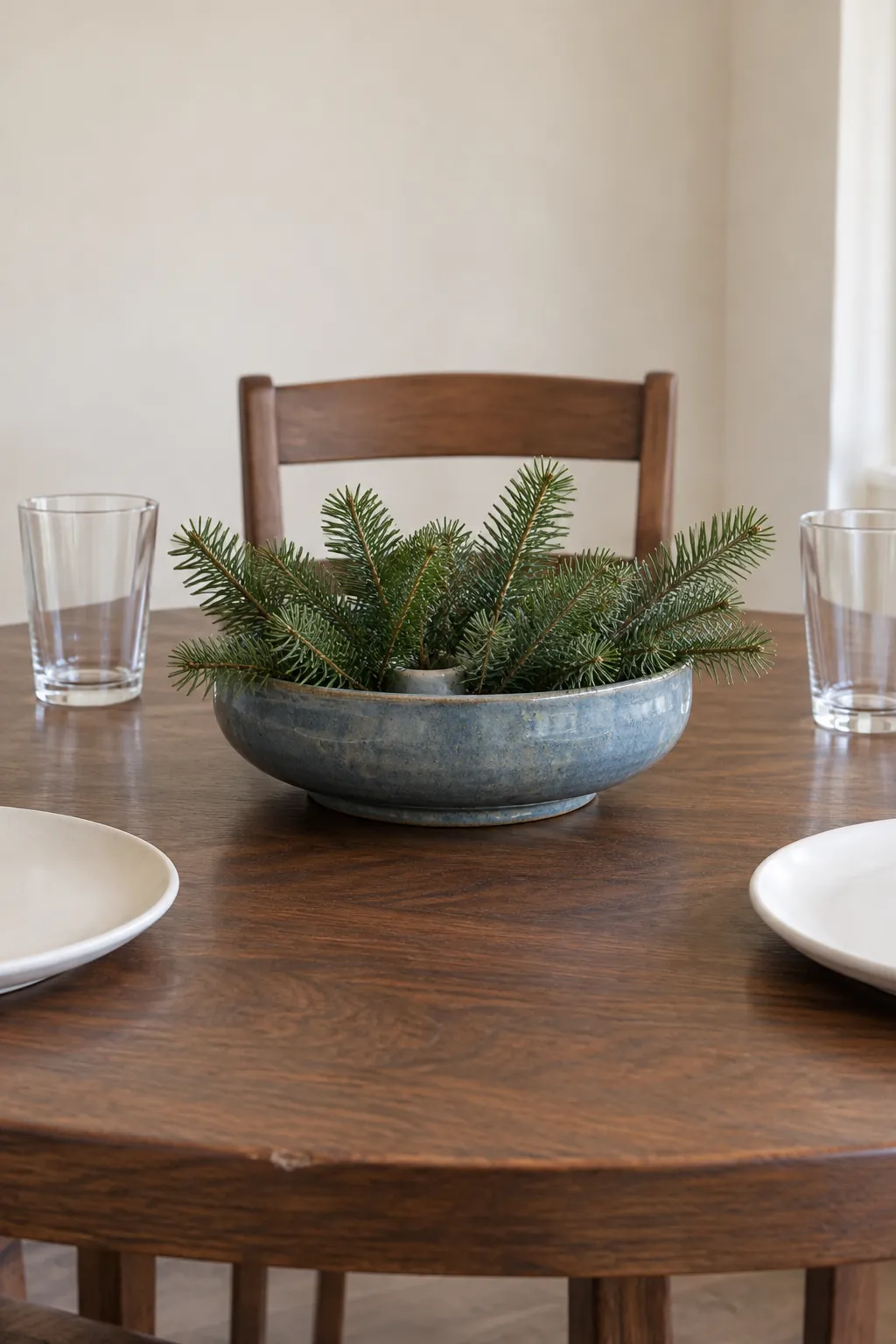 A stoneware centerpiece in a natural Christmas home