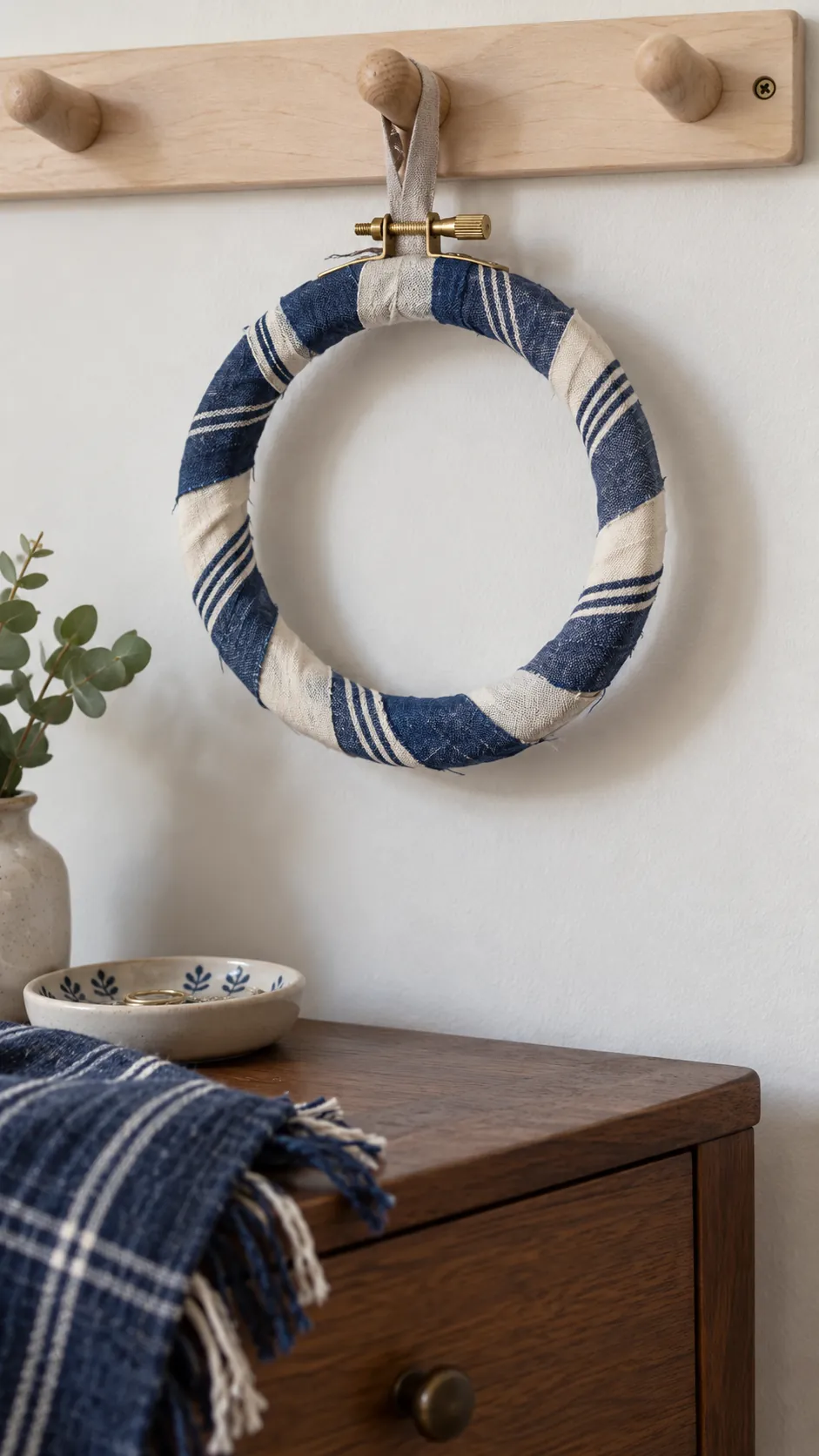 Wood embroidery hoop wrapped with short fabric strips