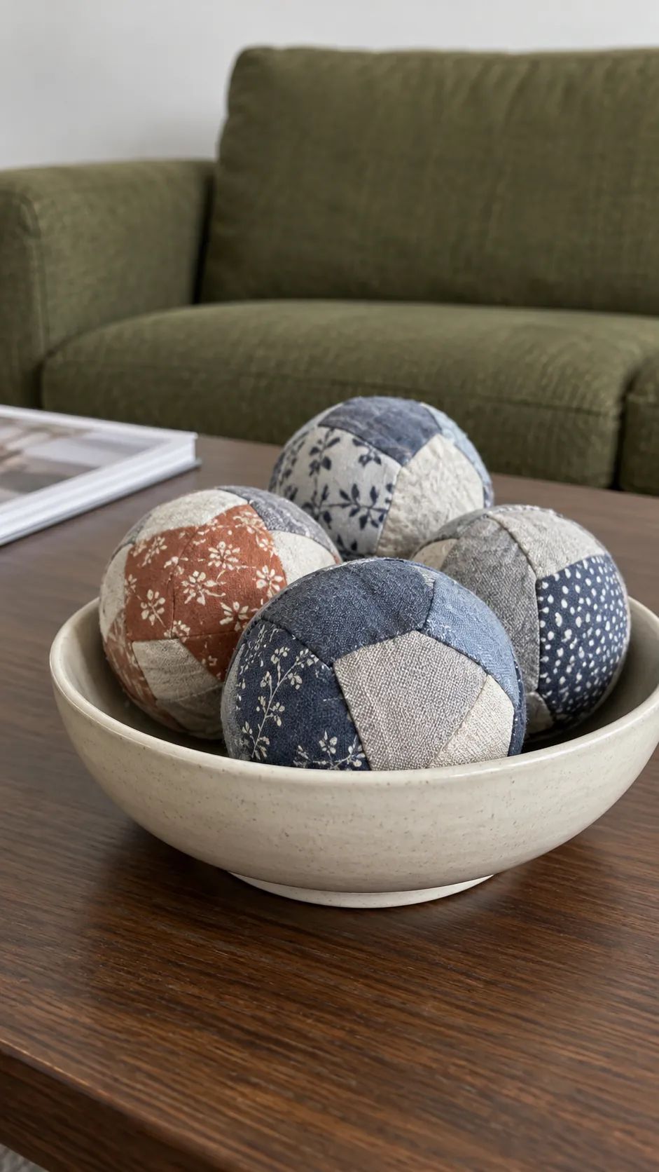 Small fabric covered decorative balls in a shallow bowl