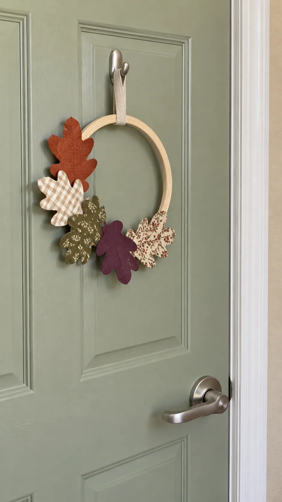Fabric covered seasonal leaf shapes on a small indoor decorative ring