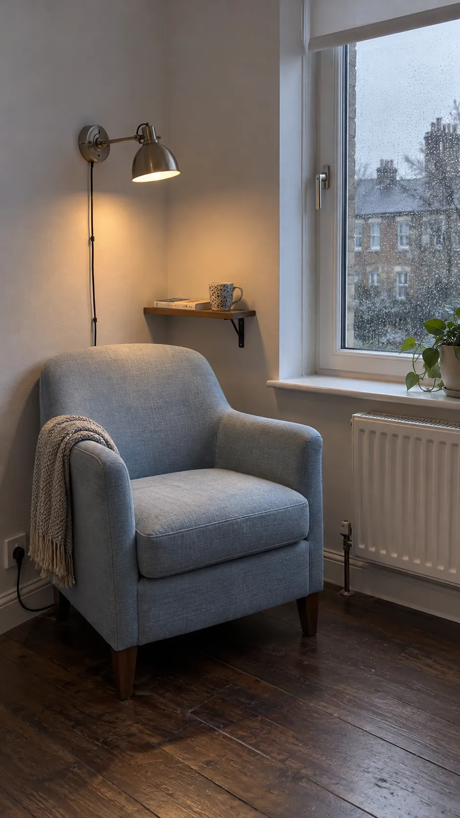 Window chair with a wall light in a small living room