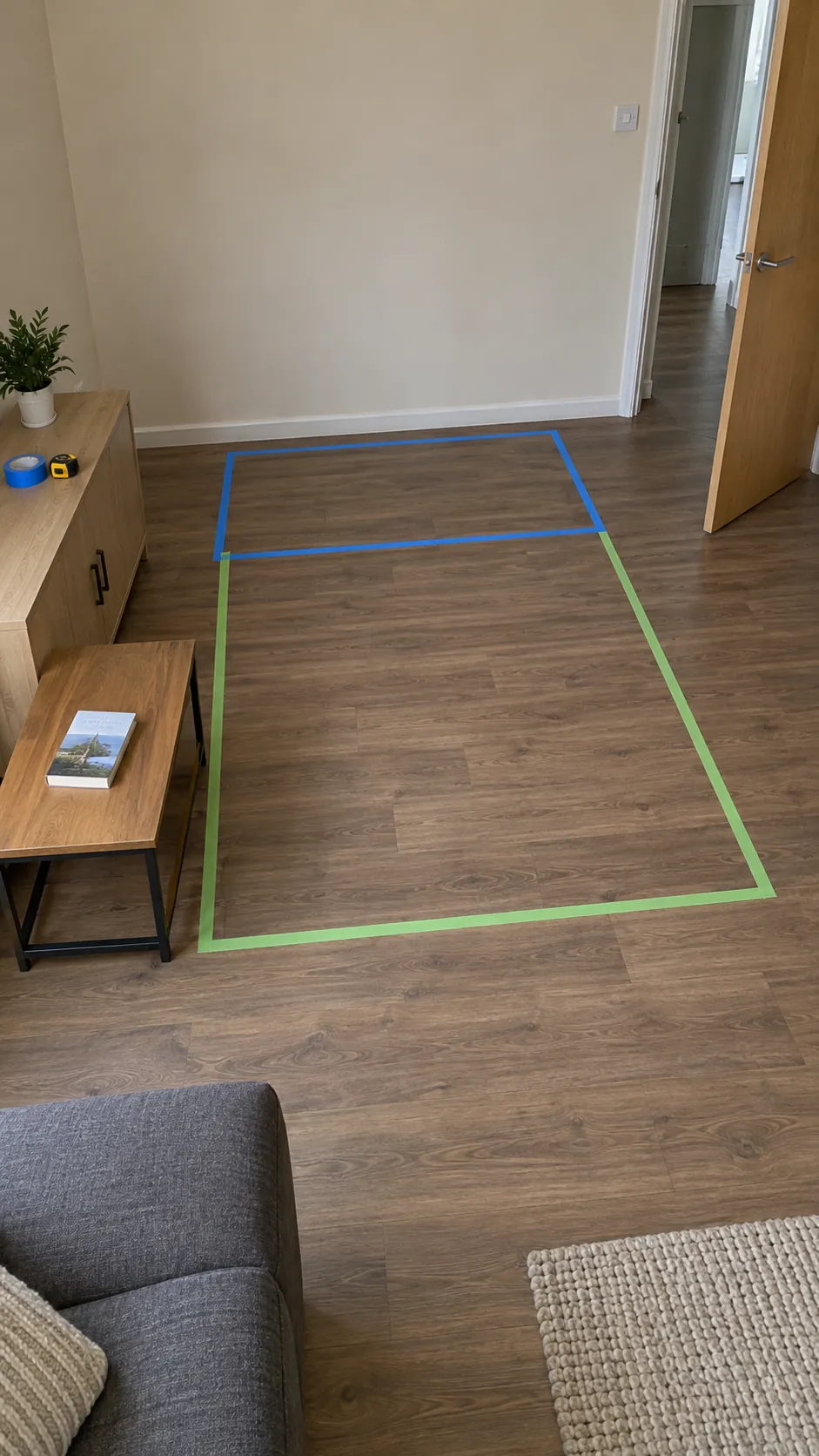 Test both furniture footprints and circulation with real removable tape in a small living room
