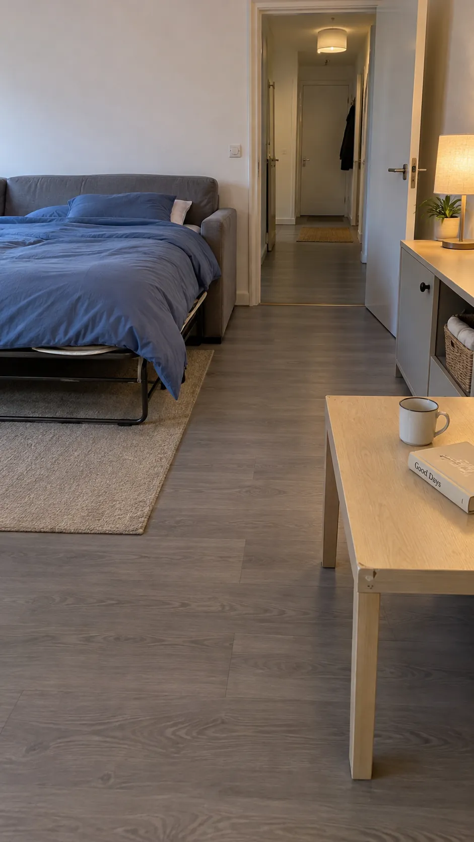 Locate the nighttime coffee table position without consuming the route from the bed in a small living room