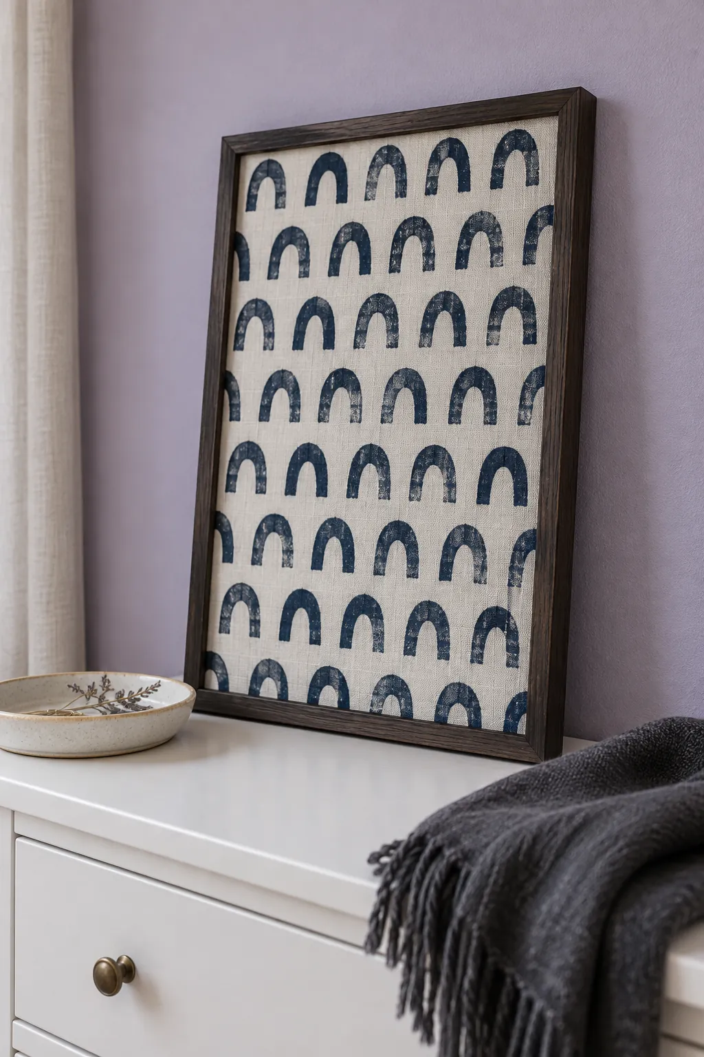 Patterned linen stretched over backing in a glassless frame
