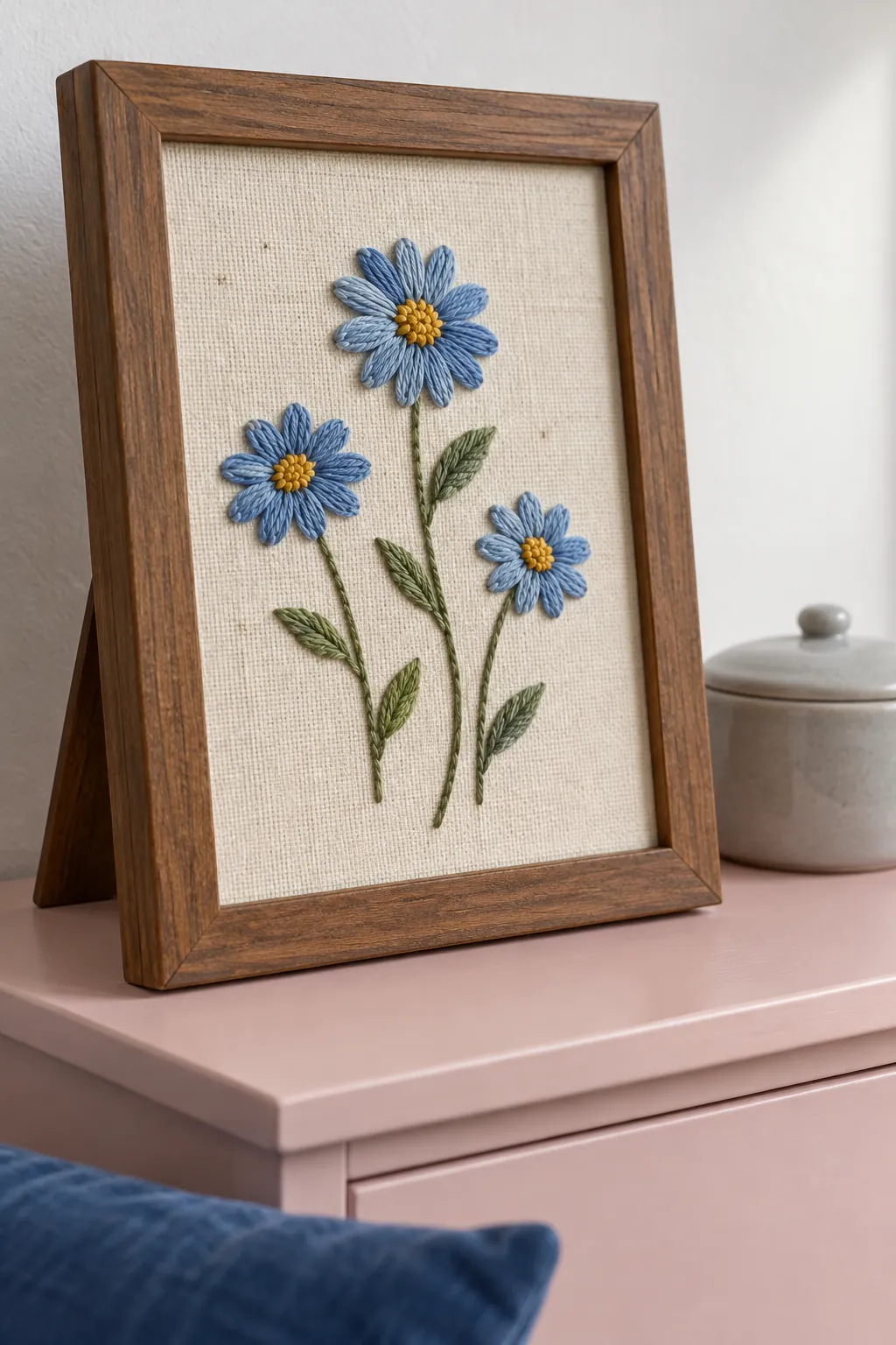 Finished embroidery mounted smoothly inside a glassless frame