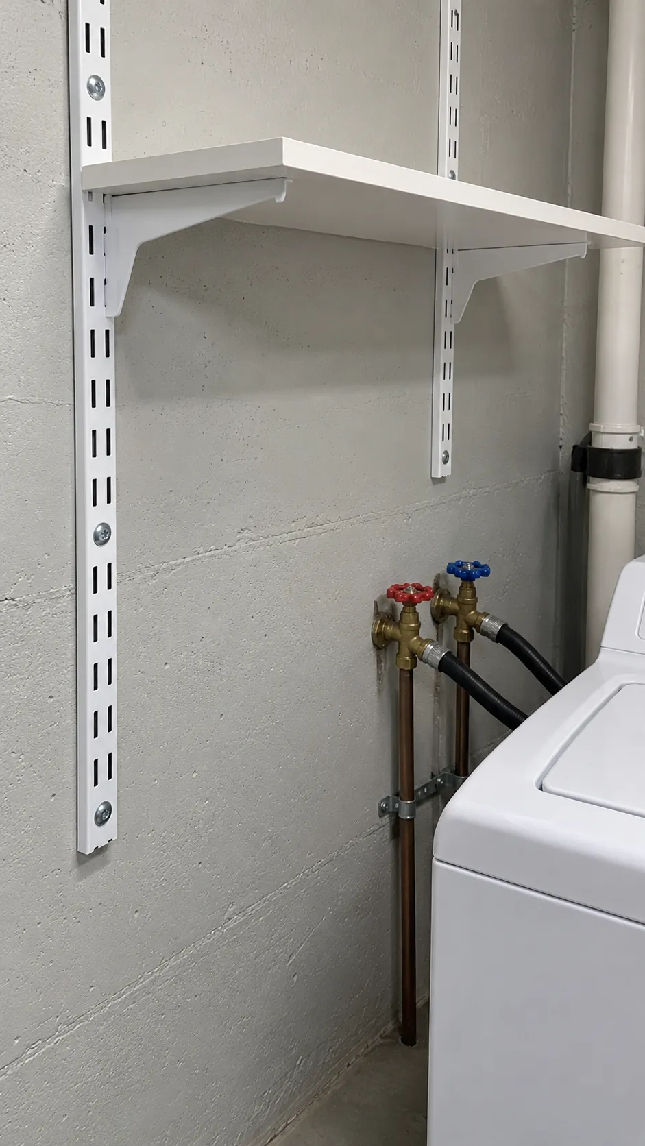 Choose supports that fit the wall and preserve service access for shelving above a top loading washer