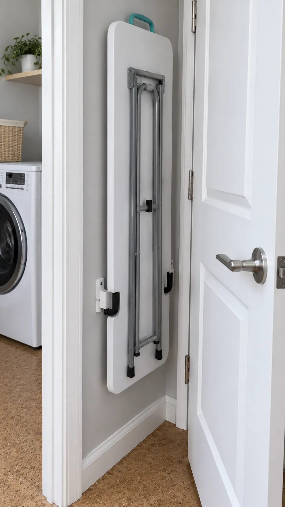 A folding table that parks behind the door as a temporary small laundry folding station