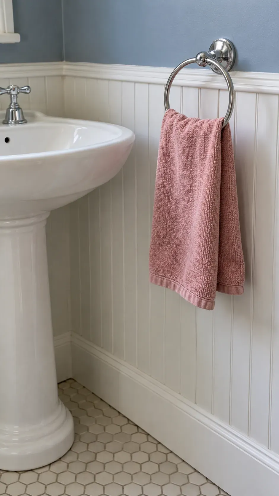Open drying towel on a ring, side medium view, blue beadboard and rose cotton