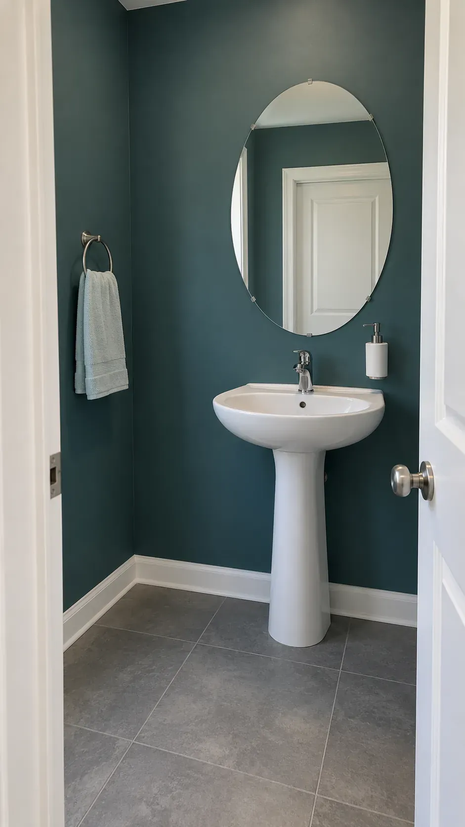 Paint carries the room color, wide doorway view, dusty teal and bare porcelain